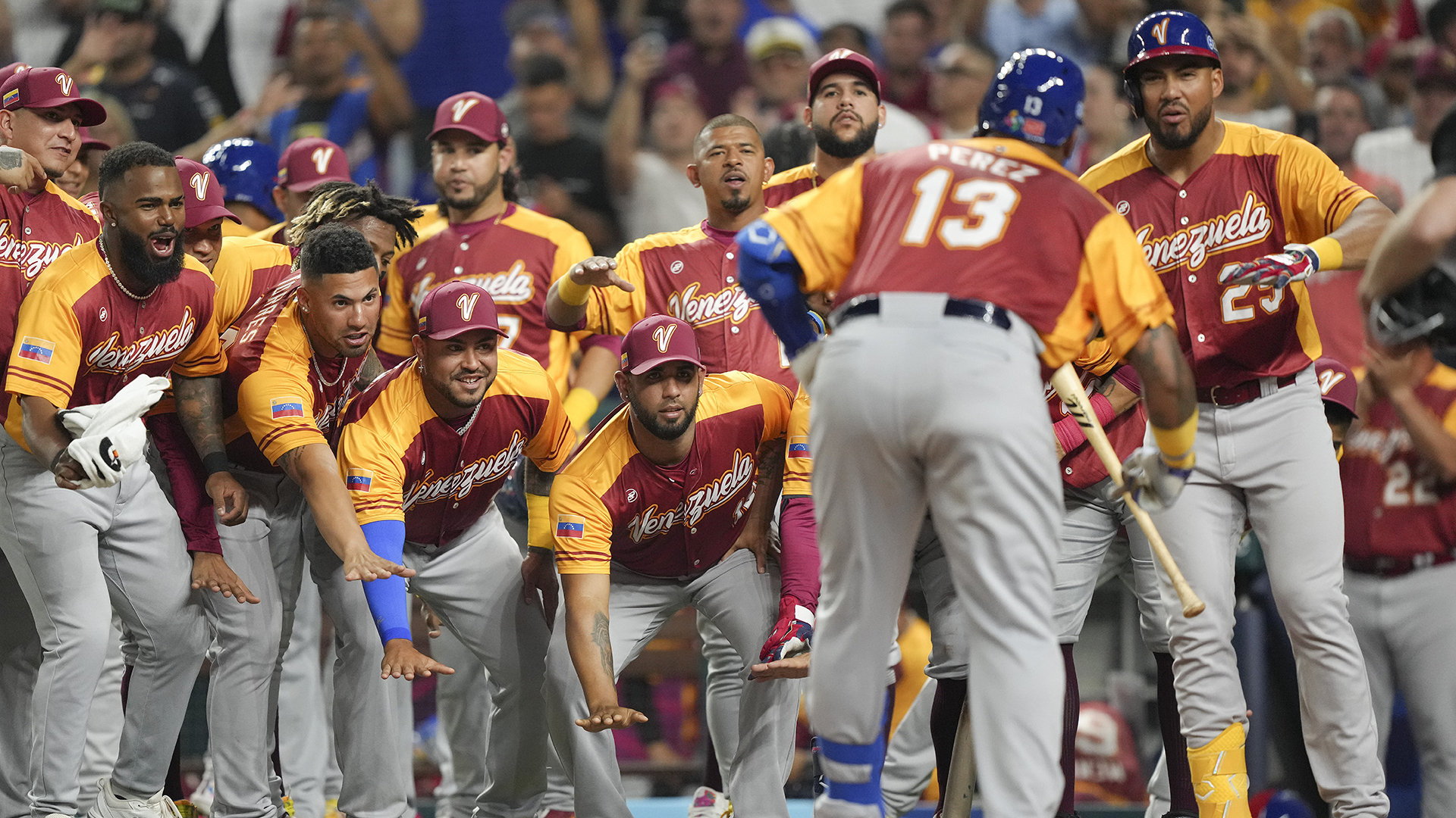 MIAMI, FLORIDA - MARCH 12: Salvador Perez #13 of Venezuela celebrates with teammates after hitting a home run in the second inning against Puerto Rico at loanDepot park on March 12, 2023 in Miami, Florida.