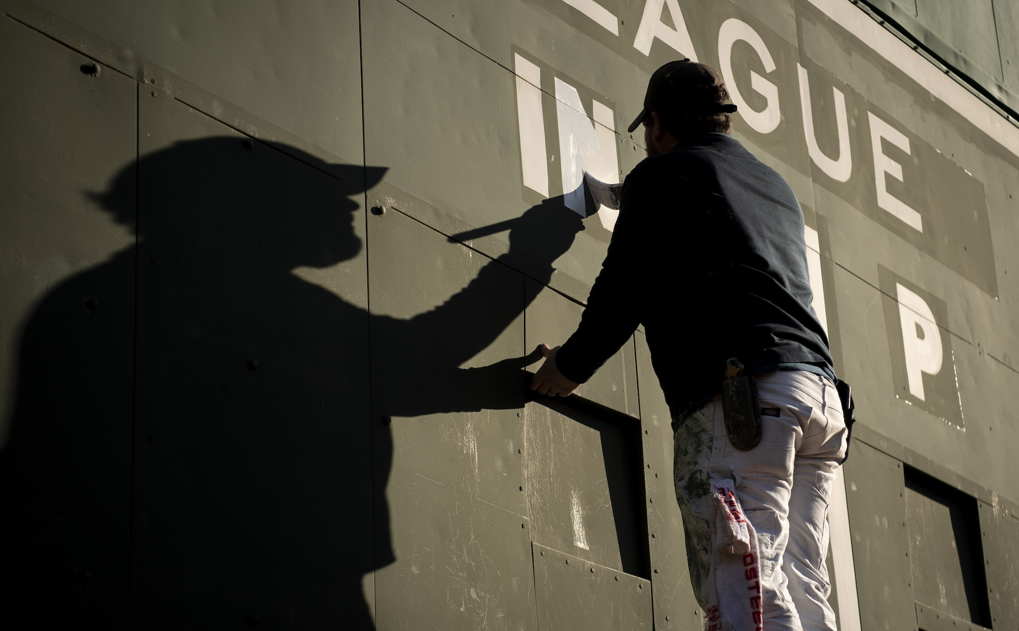 BOSTON, MASSACHUSETTS - MARCH 21: The Green Monster is painted ahead of 2023 MLB Opening Day on March 21, 2023 at Fenway Park in Boston, Massachusetts. (Photo by Maddie Malhotra/Boston Red Sox/Getty Images) *** Local Caption ***