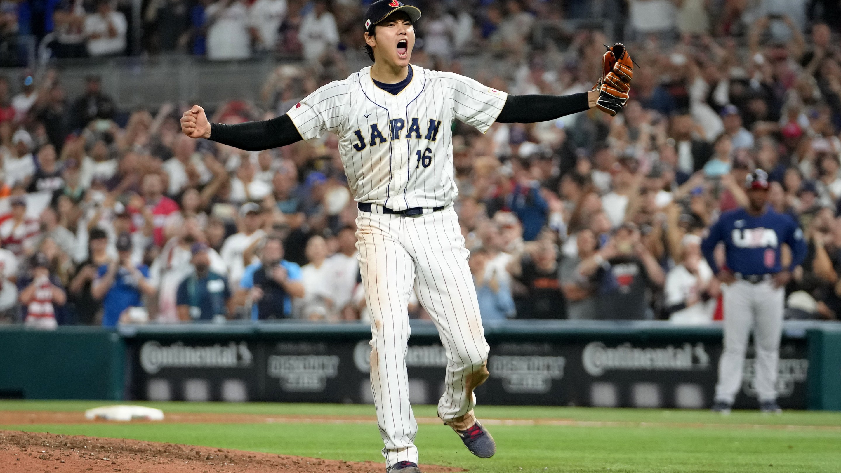 Shohei Ohtani exultantly celebrating after getting the final out in Japan's victory over Team USA in the World Baseball Classic.