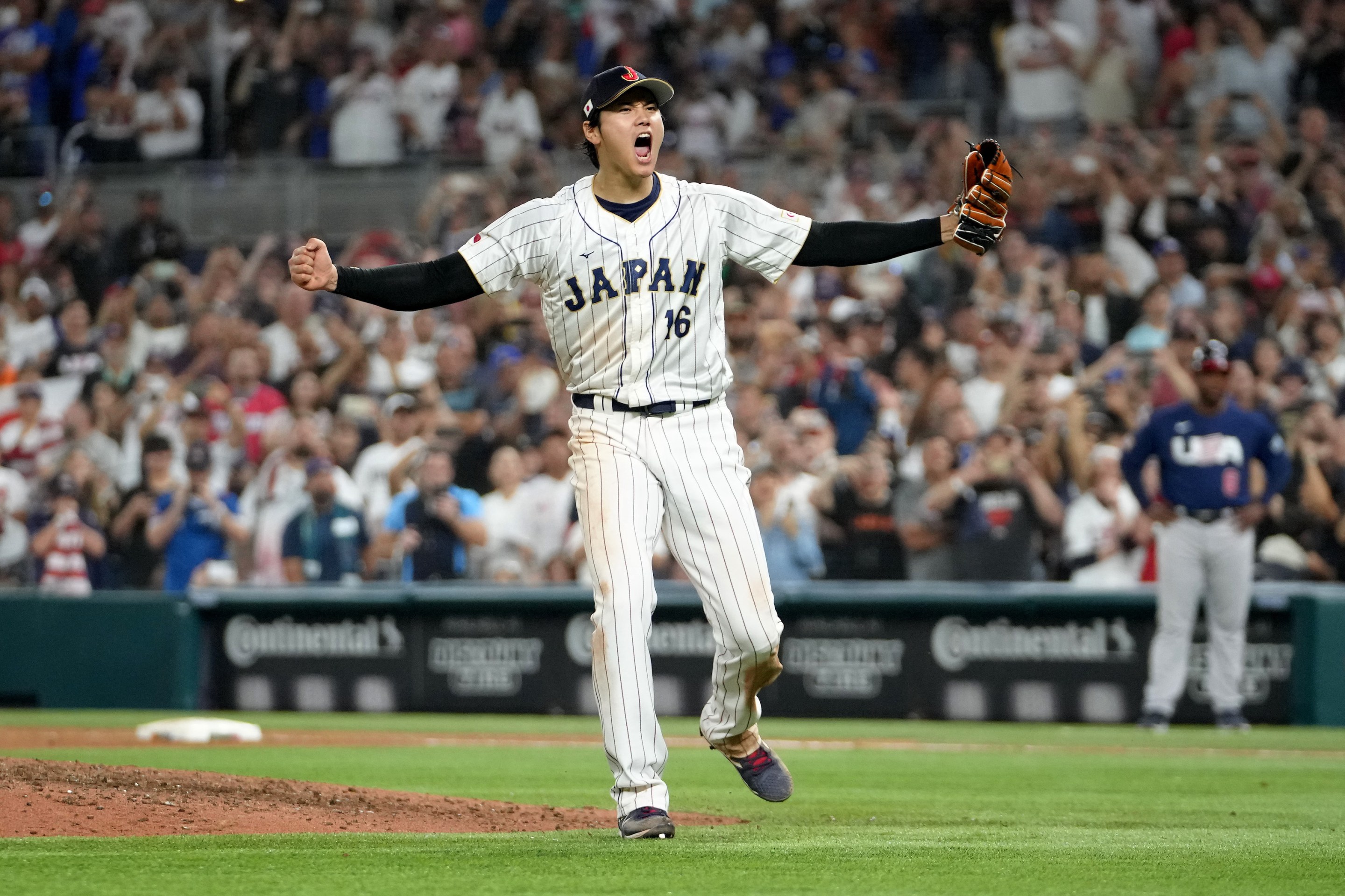 Shohei Ohtani exultantly celebrating after getting the final out in Japan's victory over Team USA in the World Baseball Classic.