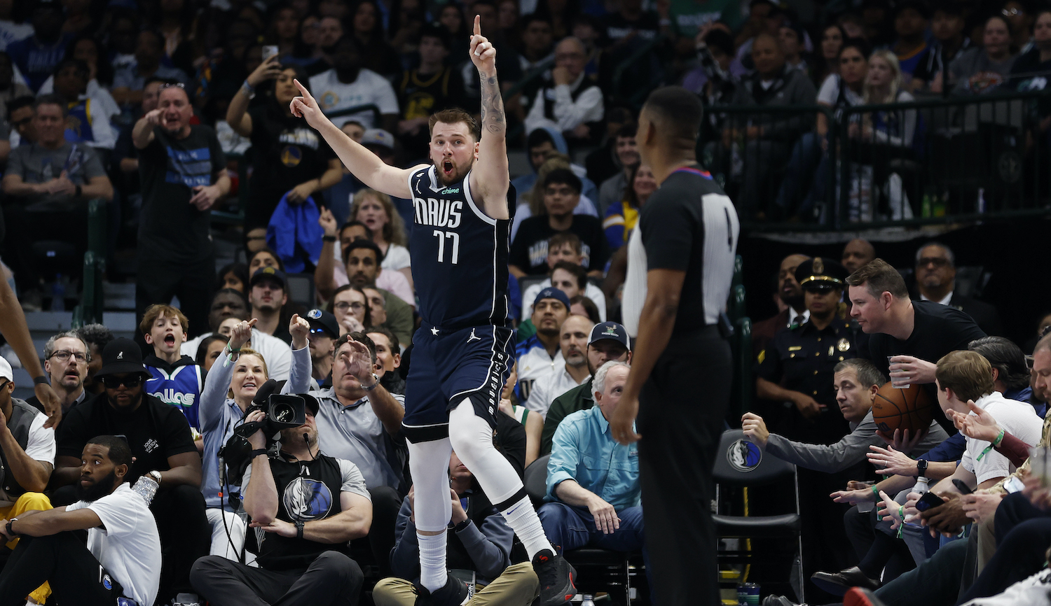 DALLAS, TEXAS - MARCH 22: Luka Doncic #77 of the Dallas Mavericks reacts after a call in the second half against the Golden State Warriors at American Airlines Center on March 22, 2023 in Dallas, Texas. NOTE TO USER: User expressly acknowledges and agrees that, by downloading and or using this photograph, User is consenting to the terms and conditions of the Getty Images License Agreement. (Photo by Tim Heitman/Getty Images)