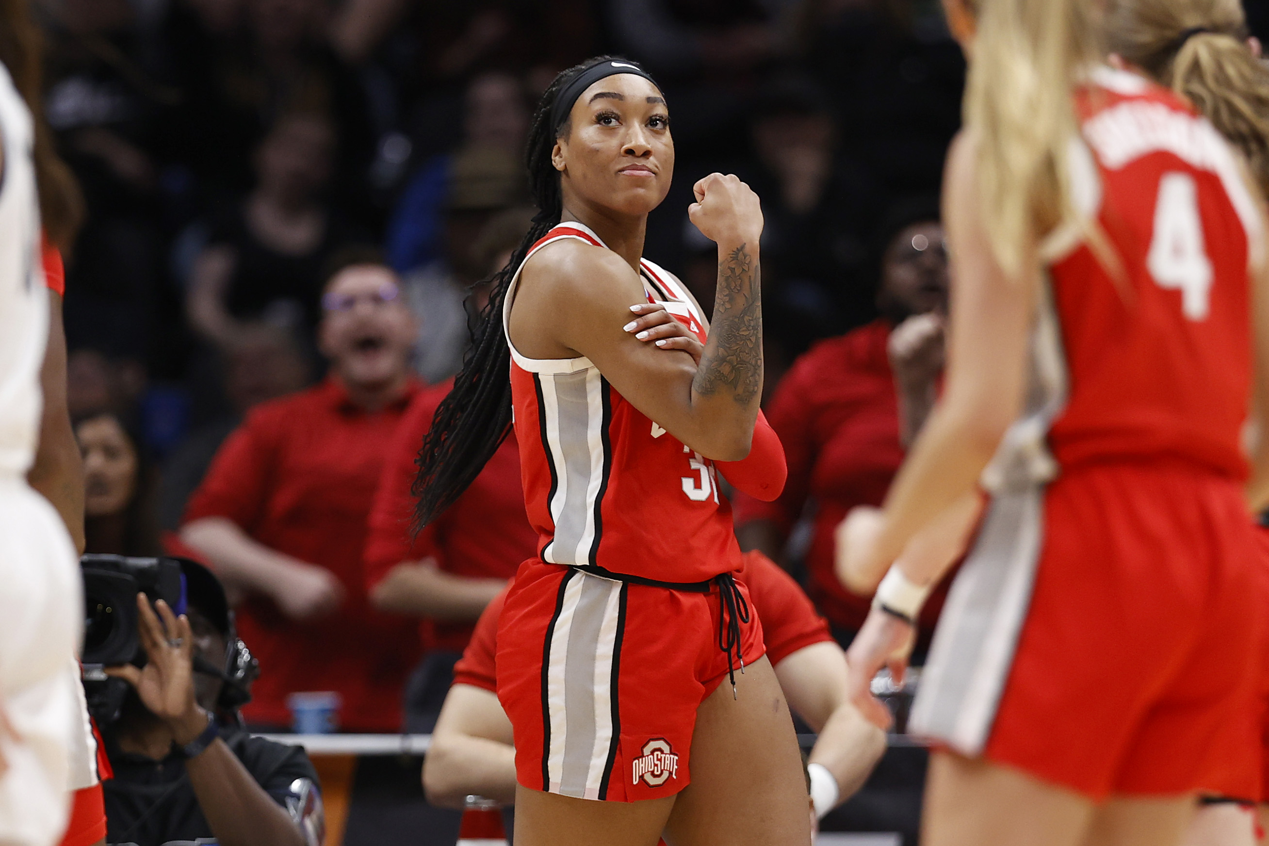 Cotie McMahon #32 of the Ohio State Buckeyes reacts after being fouled and making the basket during the fourth quarter against the UConn Huskies in the Sweet 16 round of the NCAA Women's Basketball Tournament at Climate Pledge Arena on March 25, 2023 in Seattle, Washington.