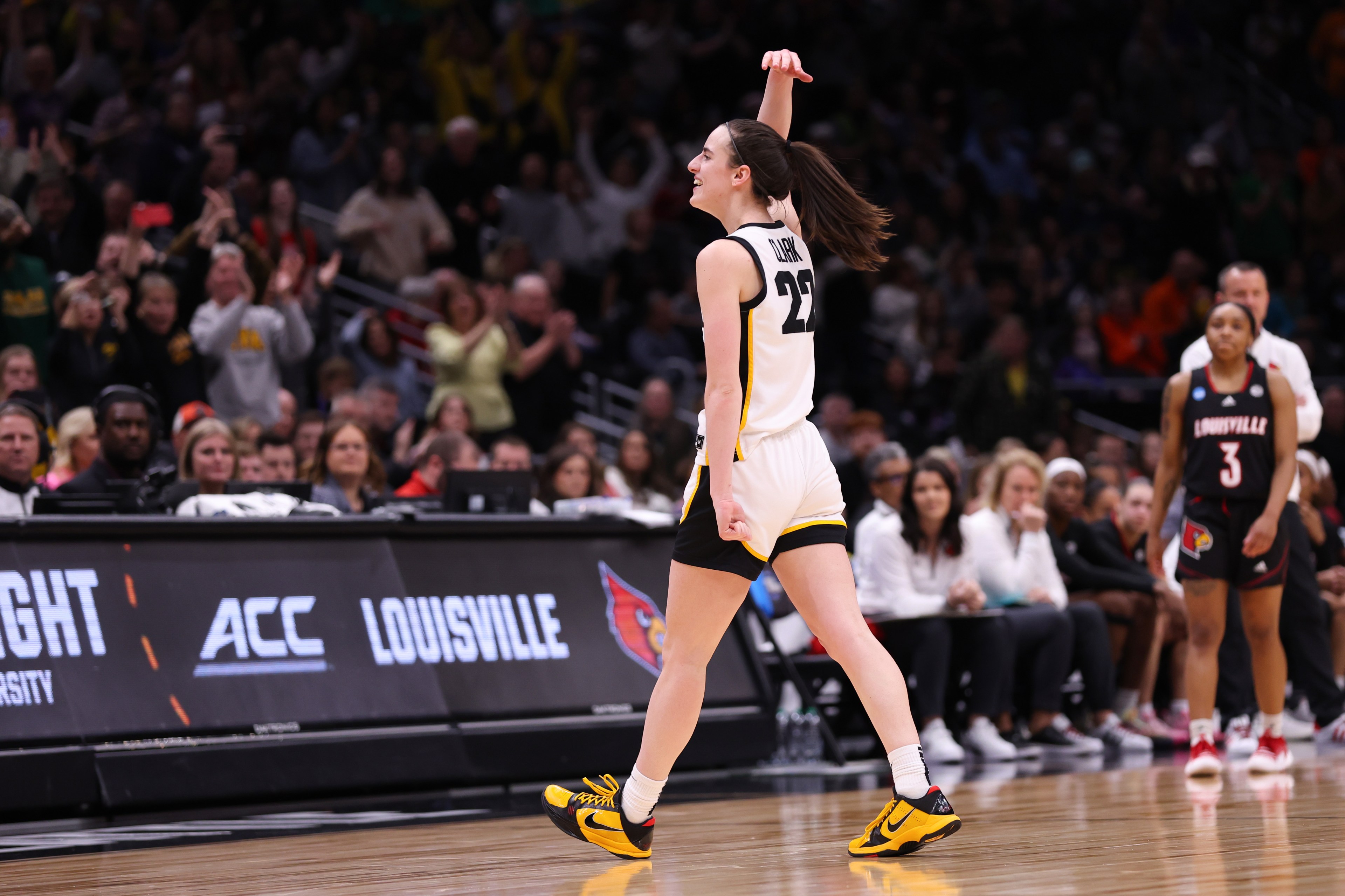 Caitlin Clark #22 of the Iowa Hawkeyes reacts during the fourth quarter against the Louisville Cardinals in the Elite Eight round of the NCAA Women's Basketball Tournament at Climate Pledge Arena on March 26, 2023 in Seattle, Washington.