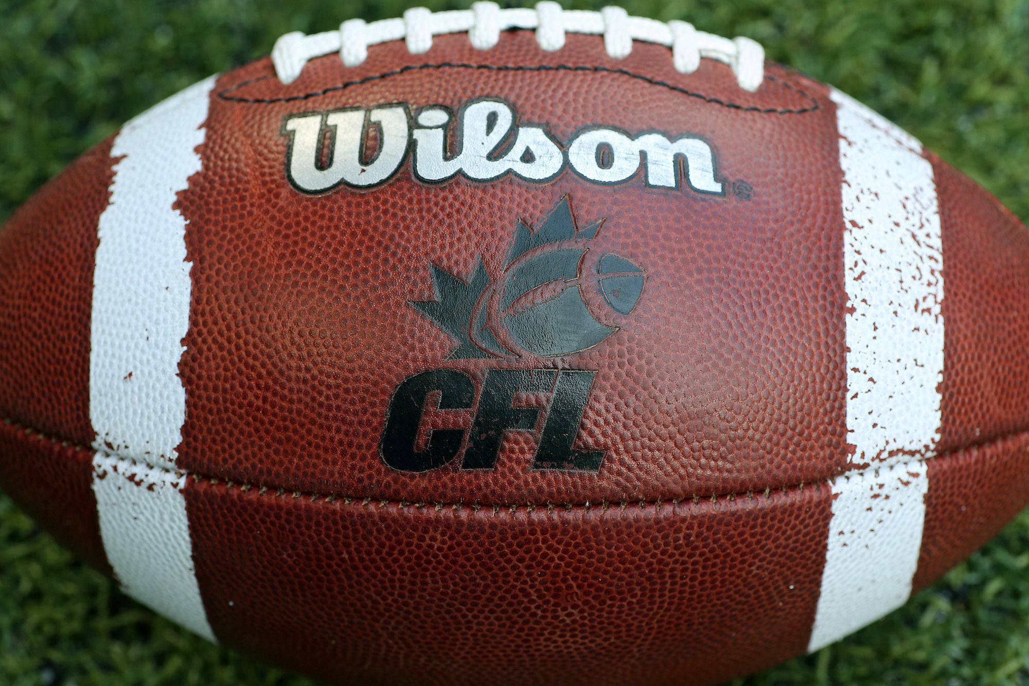 TORONTO, CANADA - JULY 11: A CFL logo on an official Canadian CFL league ball during warm-ups before the Saskatchewan Roughriders CFL game against the Toronto Argonauts on July 11, 2013 at Rogers Centre in Toronto, Ontario, Canada. (Photo by Tom Szczerbowski/Getty Images)