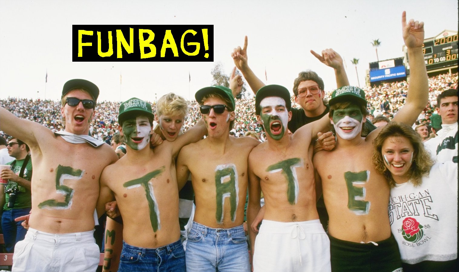 Fans of the Michigan State Spartans write ''state'' on their chests during a game against the Southern California Trojans at the Rose in Pasadena, California. Michigan State won the game 20-17.