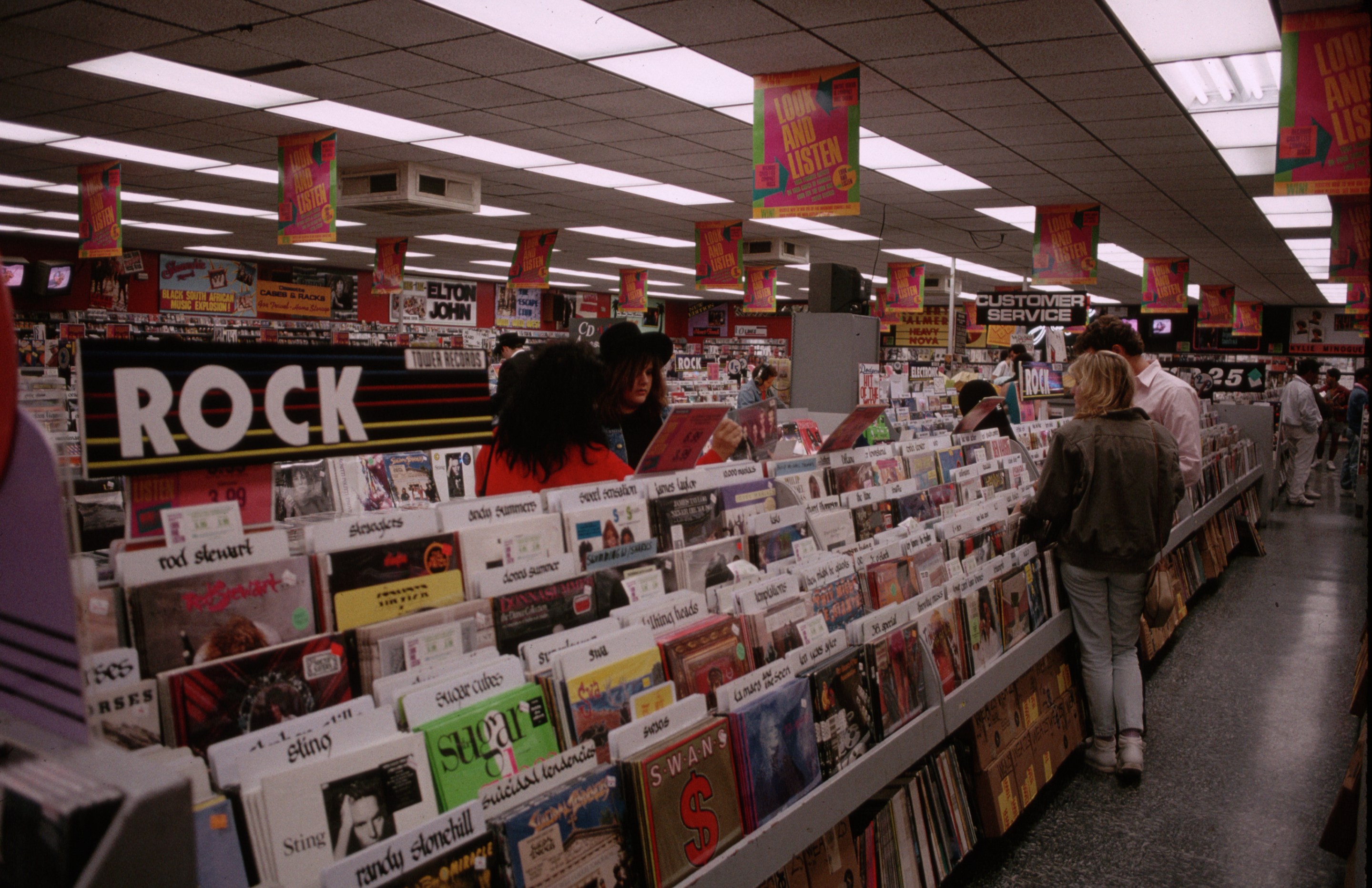 Shoppers Looking at Records at Tower Records on Sunset Boulevard (Photo by nik wheeler/Corbis via Getty Images)