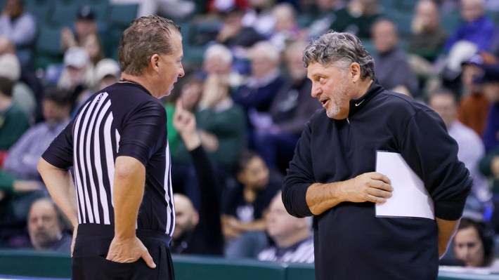 CLEVELAND, OH - DECEMBER 01: Oakland Golden Grizzlies head coach Greg Kampe discusses a call with an official during the second half of the men's college basketball game between the Oakland Golden Grizzlies and Cleveland State Vikings on December 1, 2022, at the Wolstein Center in Cleveland, OH.