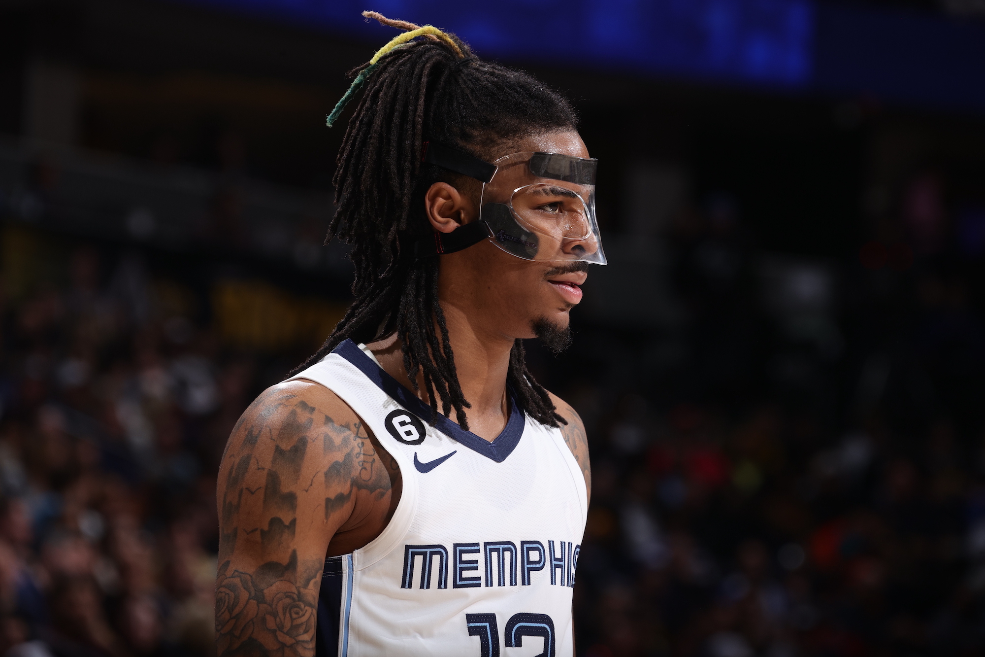 Ja Morant stands on a basketball court
