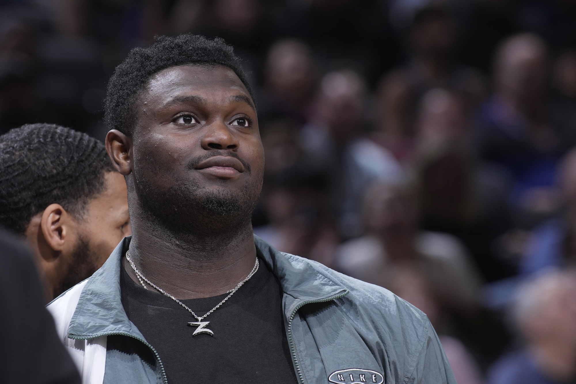 Zion Williamson looks on from the sidelines