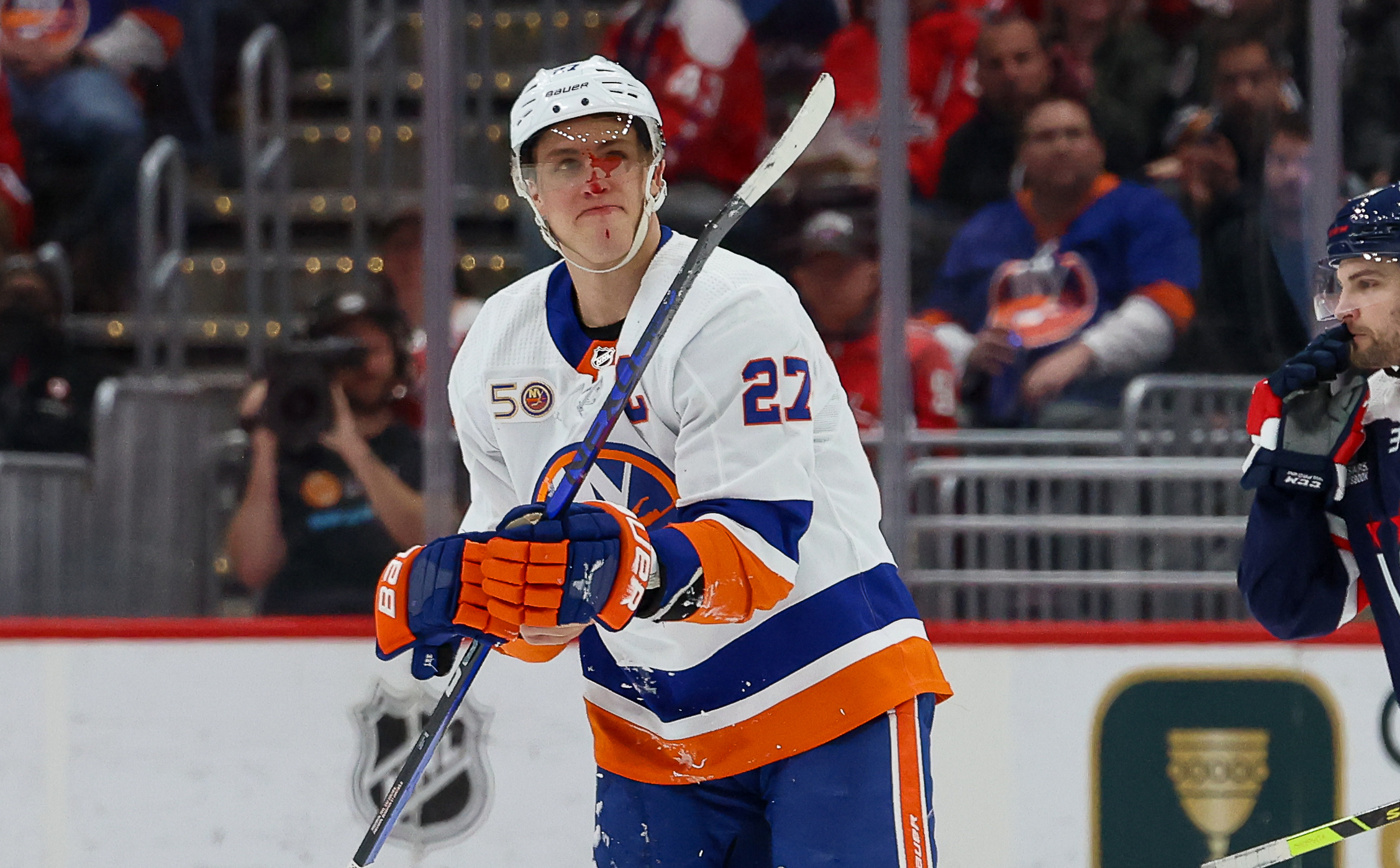 WASHINGTON, DC - APRIL 10: Anders Lee #27 of the New York Islanders leaves the ice after obtaining an injury during a game against the Washington Capitals at Capital One Arena on April 10, 2023 in Washington, D.C. (Photo by John McCreary/NHLI via Getty Images)