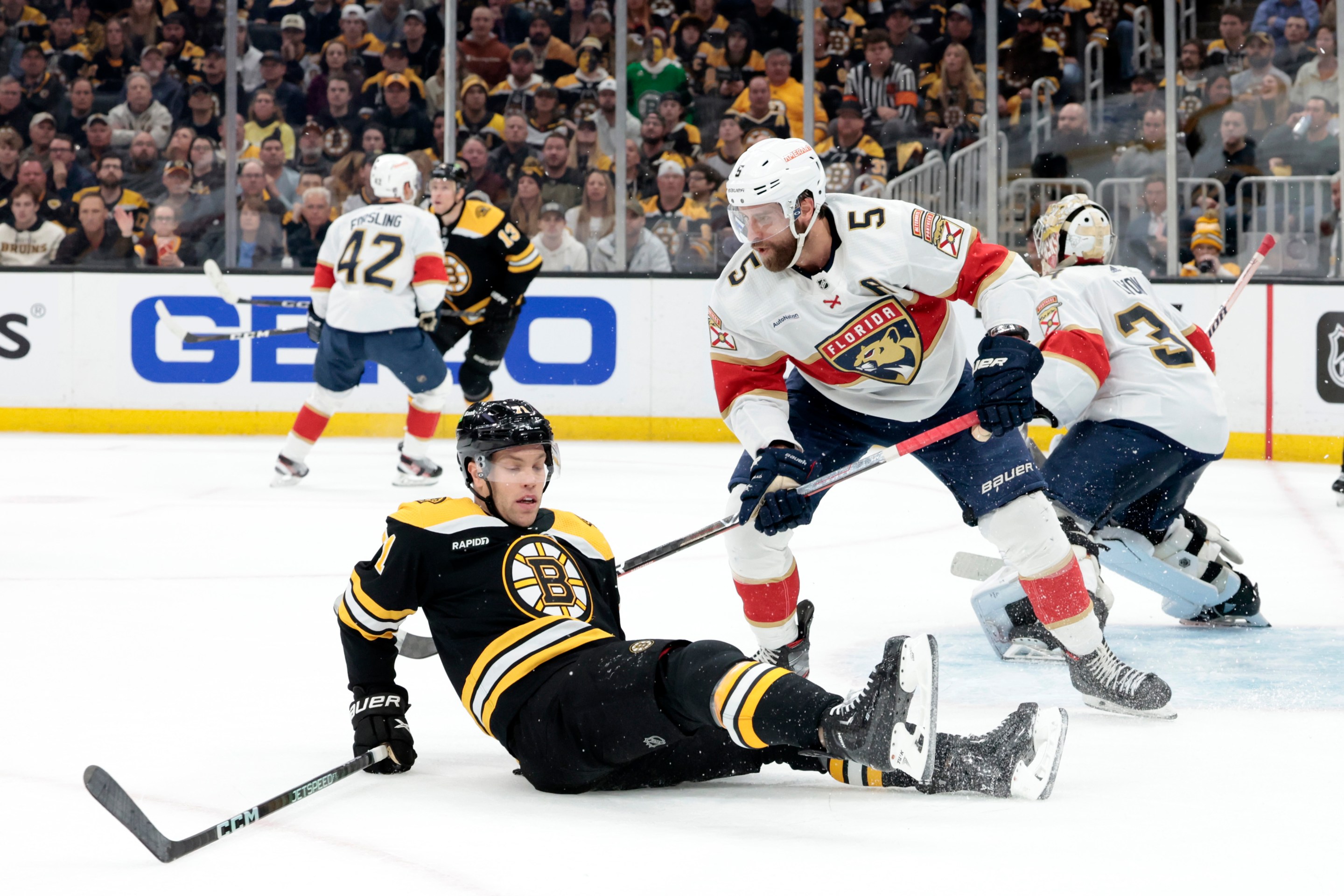 Florida Panthers defenseman Aaron Ekblad (5) dumps Boston Bruins left wing Taylor Hall (71) during Game 2 of an Eastern Conference First Round playoff contest between the Boston Bruins and the Florida Panthers on April 19, 2023, at TD Garden in Boston, Massachusetts.