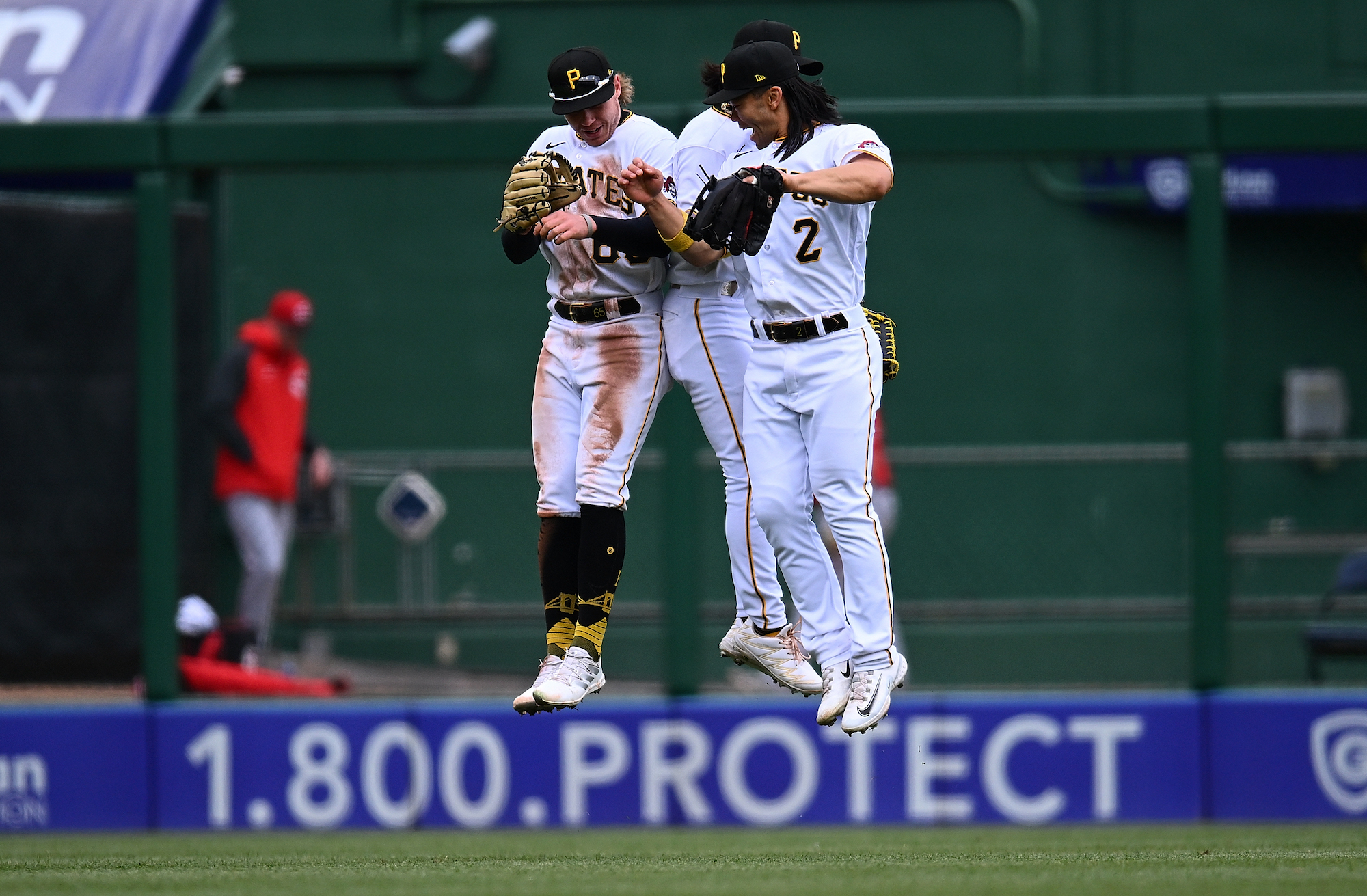 PITTSBURGH, PA - APRIL 23: Jack Suwinski #65, Ji Hwan Bae #3 and Connor Joe #2 of the Pittsburgh Pirates celebrate after a 2-0 win over the Cincinnati Reds at PNC Park on April 23, 2023 in Pittsburgh, Pennsylvania. (Photo by Joe Sargent/Getty Images)