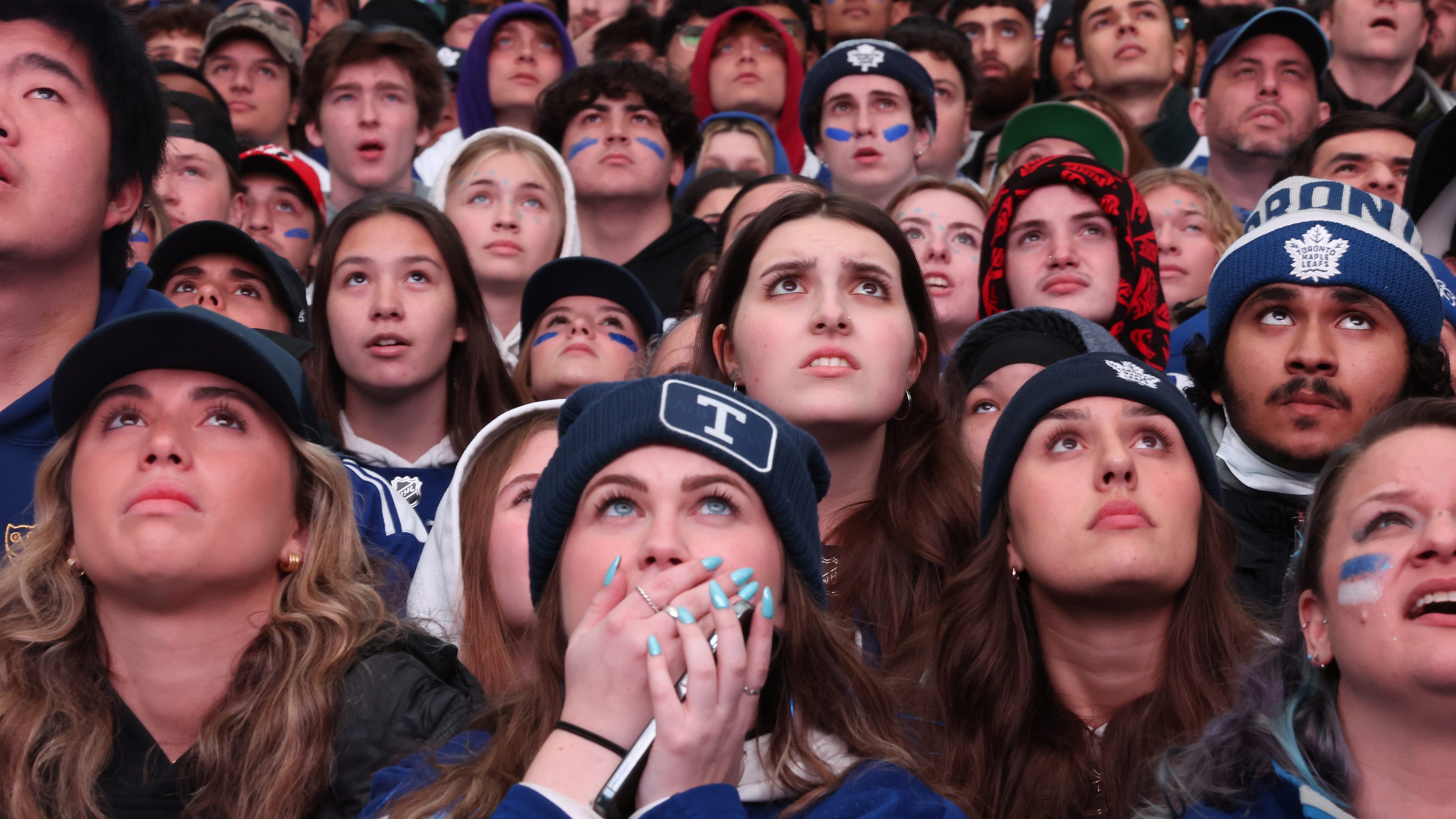 Toronto Maple Leafs fans watch, cheer, react to game 6 of their first round NHL playoffs series against Tampa Bay Lightning on the big screen in Maple Leaf Square outside Scotiabank Arena in Toronto. April 29, 2023.