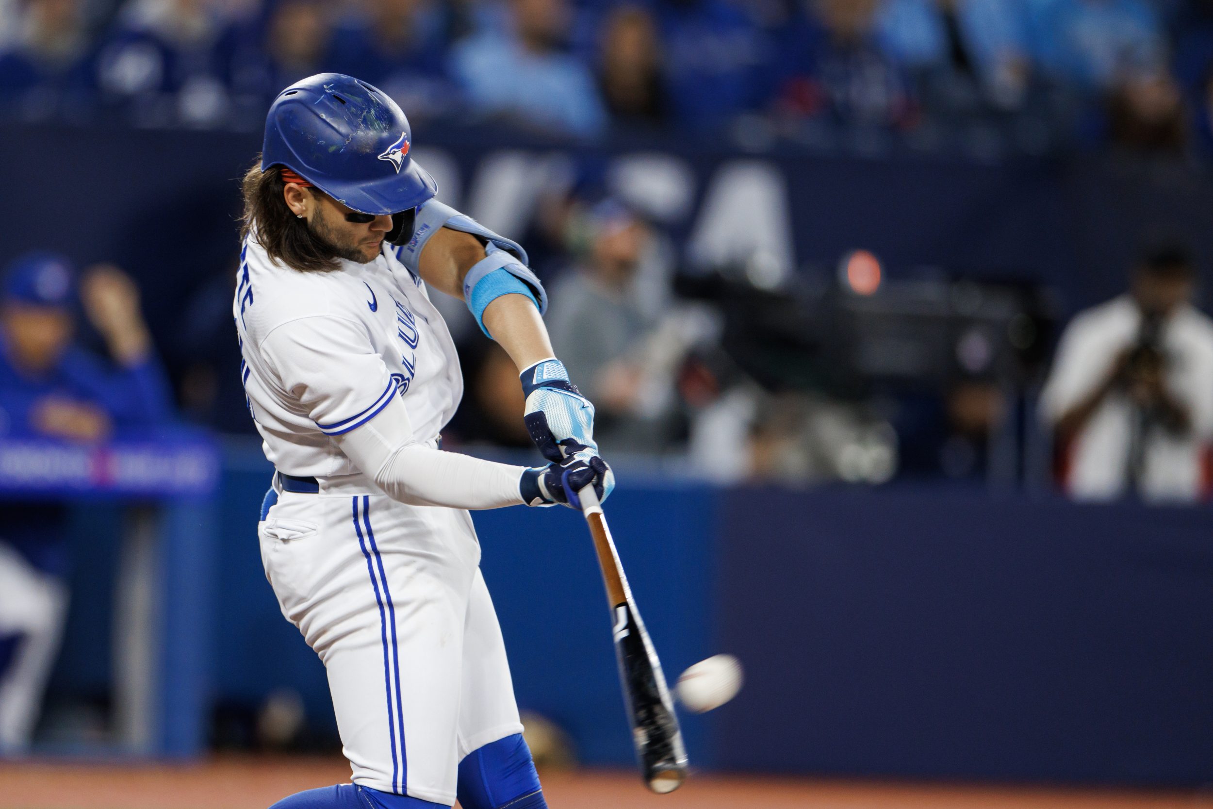 Bo Bichette #11 of the Toronto Blue Jays hits a three-run home run in the second inning