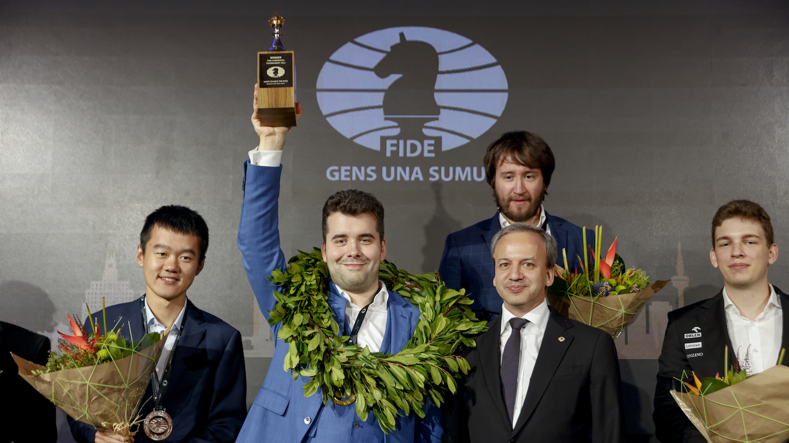 MADRID, SPAIN - JULY 5: Russian Grandmaster competing under the FIDE flag Ian Nepomniachtchi receives the award as the winner of the competition (2nd from L) with Ding Liren of China, FIDE President Arkady Dvorkovich, Teimour Radjabov of Azerbaiyán and Jan-Krzysztof Duda of Poland during the 2022 FIDE Chess Candidates Tournament closing ceremony on July 5, 2022 in Madrid, Spain. (