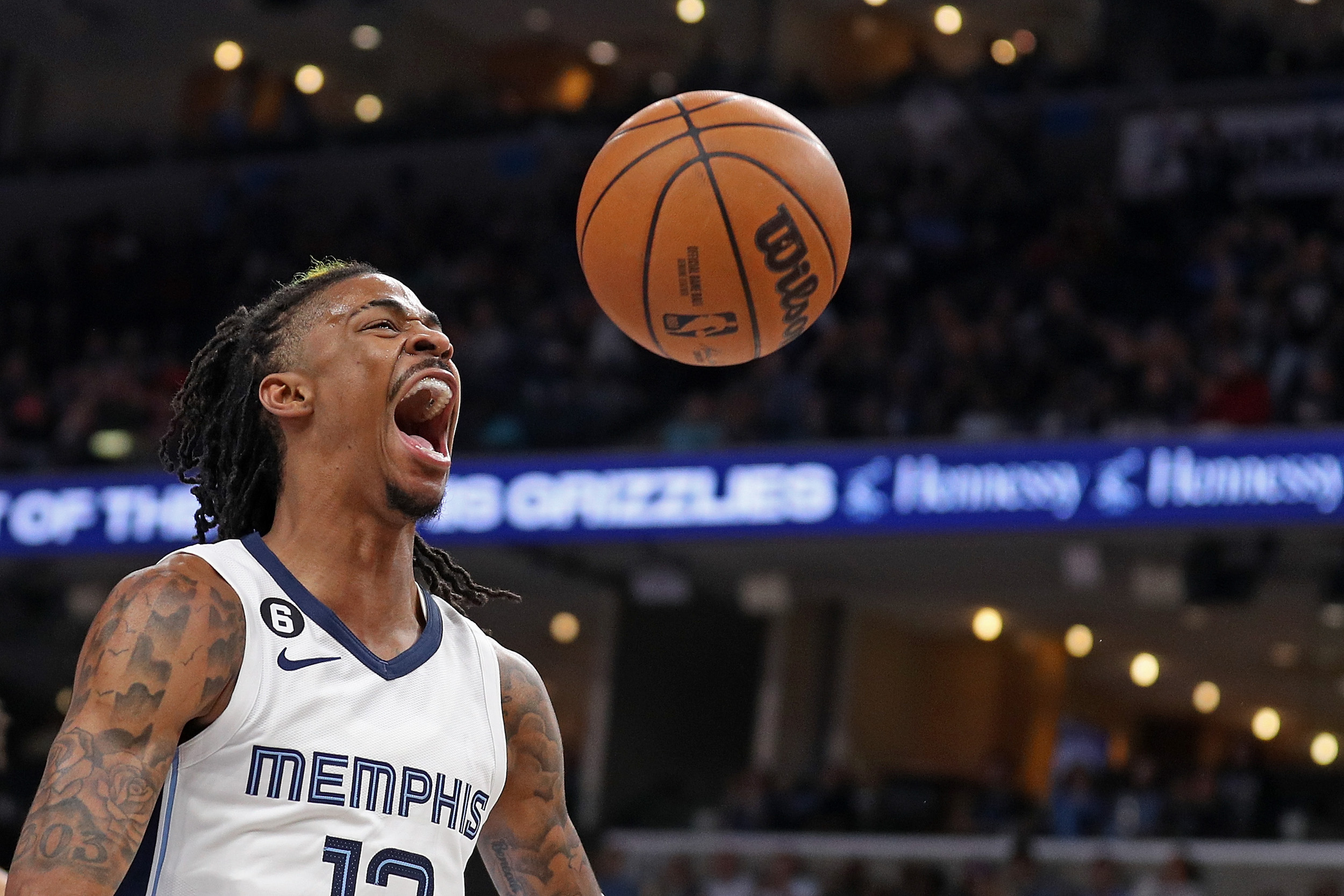 Ja Morant yells after scoring.