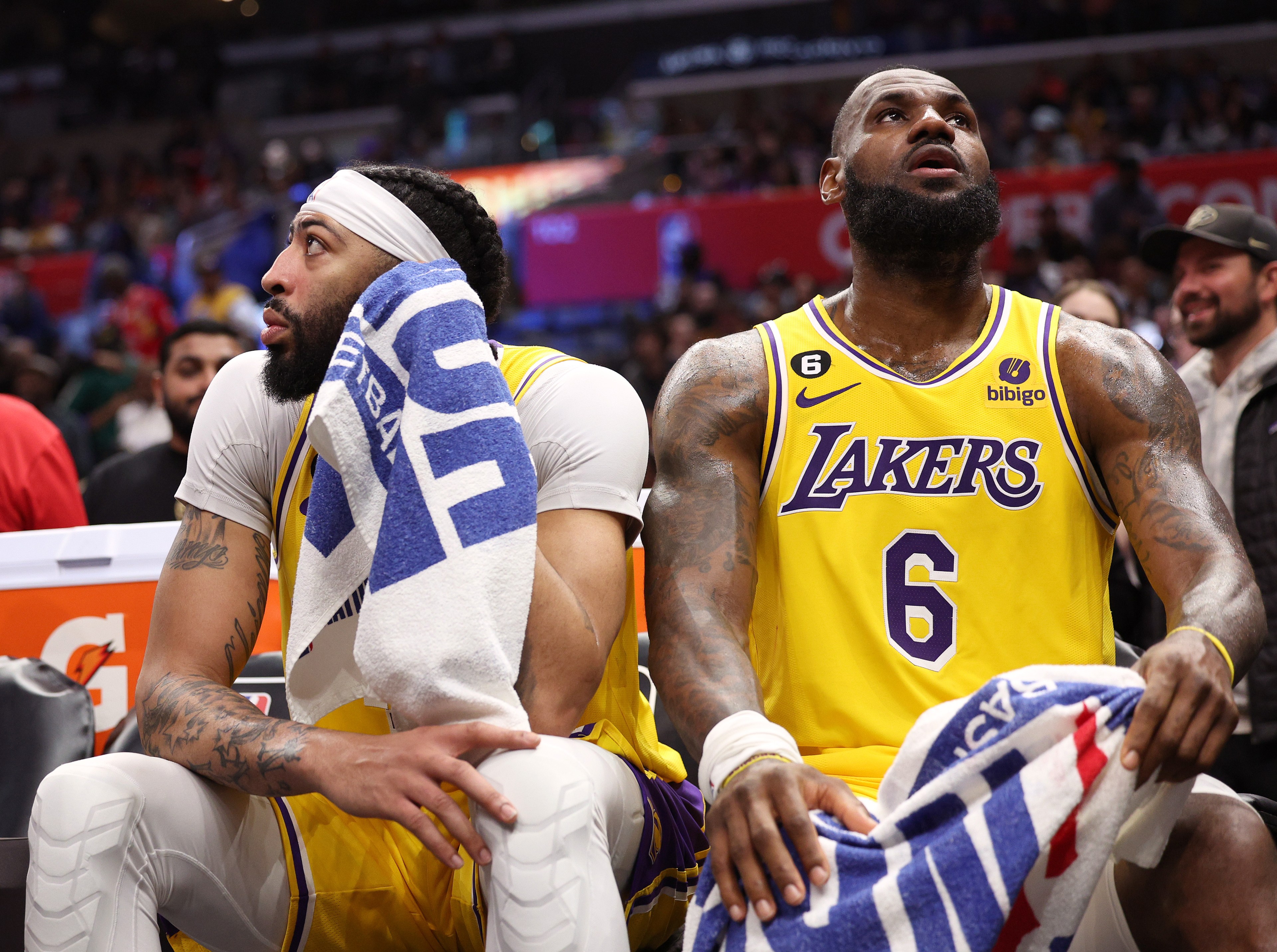LOS ANGELES, CALIFORNIA - APRIL 05: Anthony Davis #3 and LeBron James #6 of the Los Angeles Lakers react from the bench during a 125-118 LA Clippers win at Crypto.com Arena on April 05, 2023 in Los Angeles, California. NOTE TO USER: User expressly acknowledges and agrees that, by downloading and or using this photograph, User is consenting to the terms and conditions of the Getty Images License Agreement.