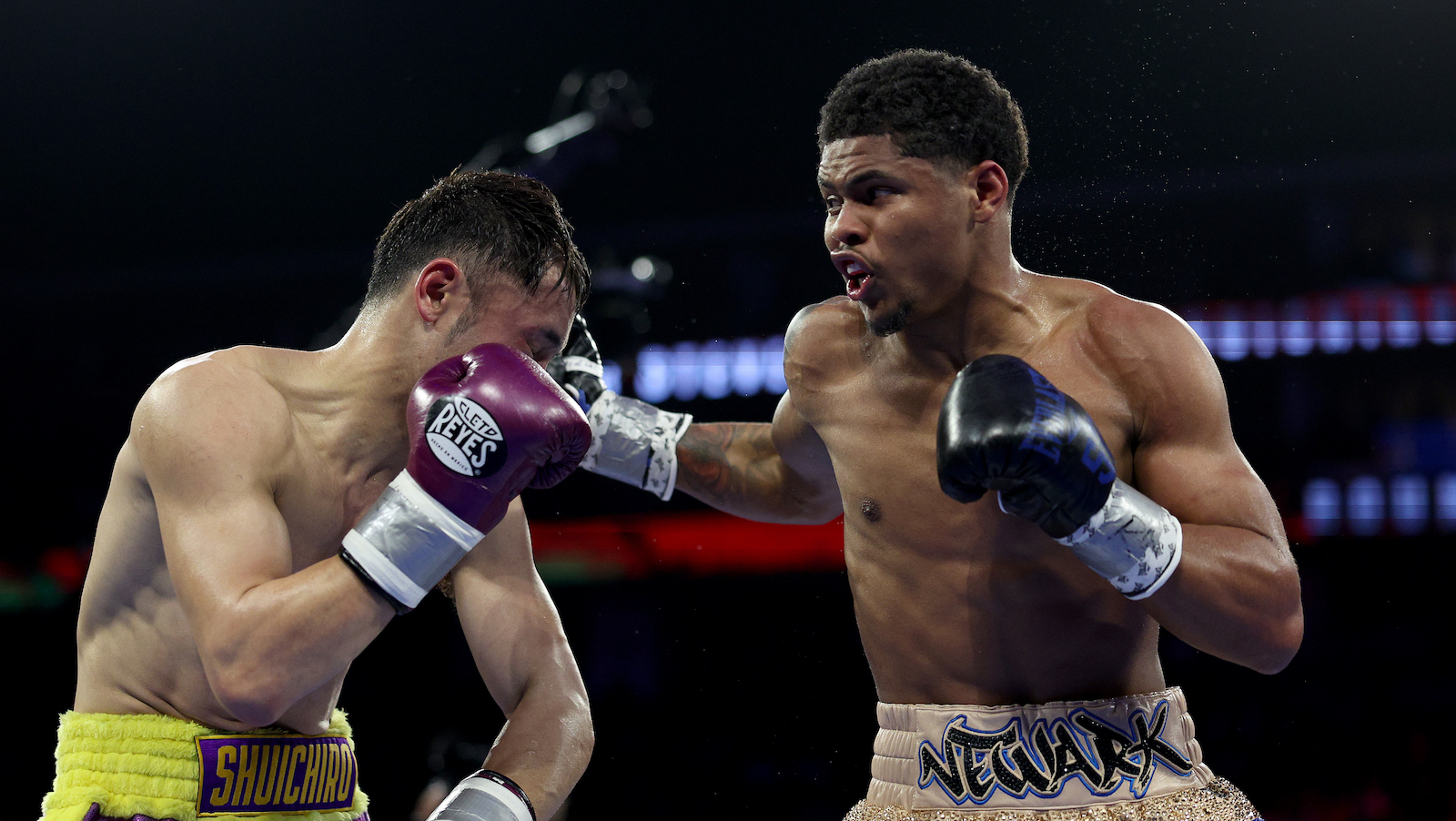 NEWARK, NEW JERSEY - APRIL 08: Shuichiro Yoshino of Japan and Shakur Stevenson of the United States exchange punches during their WBC Lightweight Final Eliminator match at Prudential Center on April 08, 2023 in Newark, New Jersey.