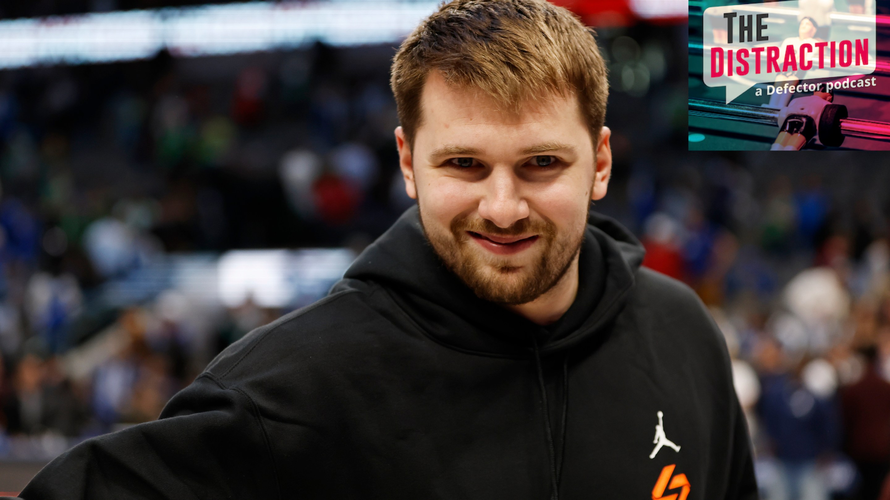 Luka Doncic smiling, kind of, for the camera before an early April Mavericks game against the Bulls in which he did not play.