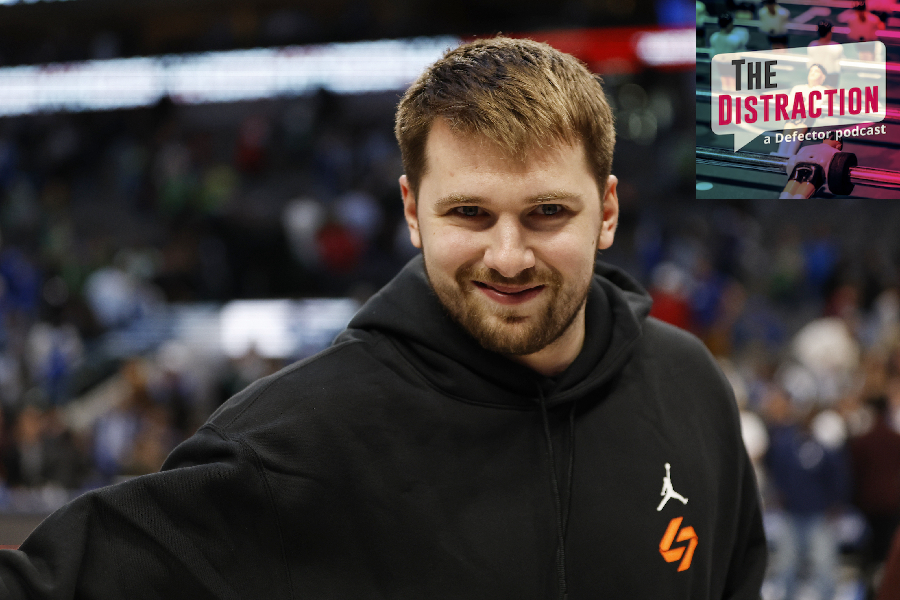 Luka Doncic smiling, kind of, for the camera before an early April Mavericks game against the Bulls in which he did not play.