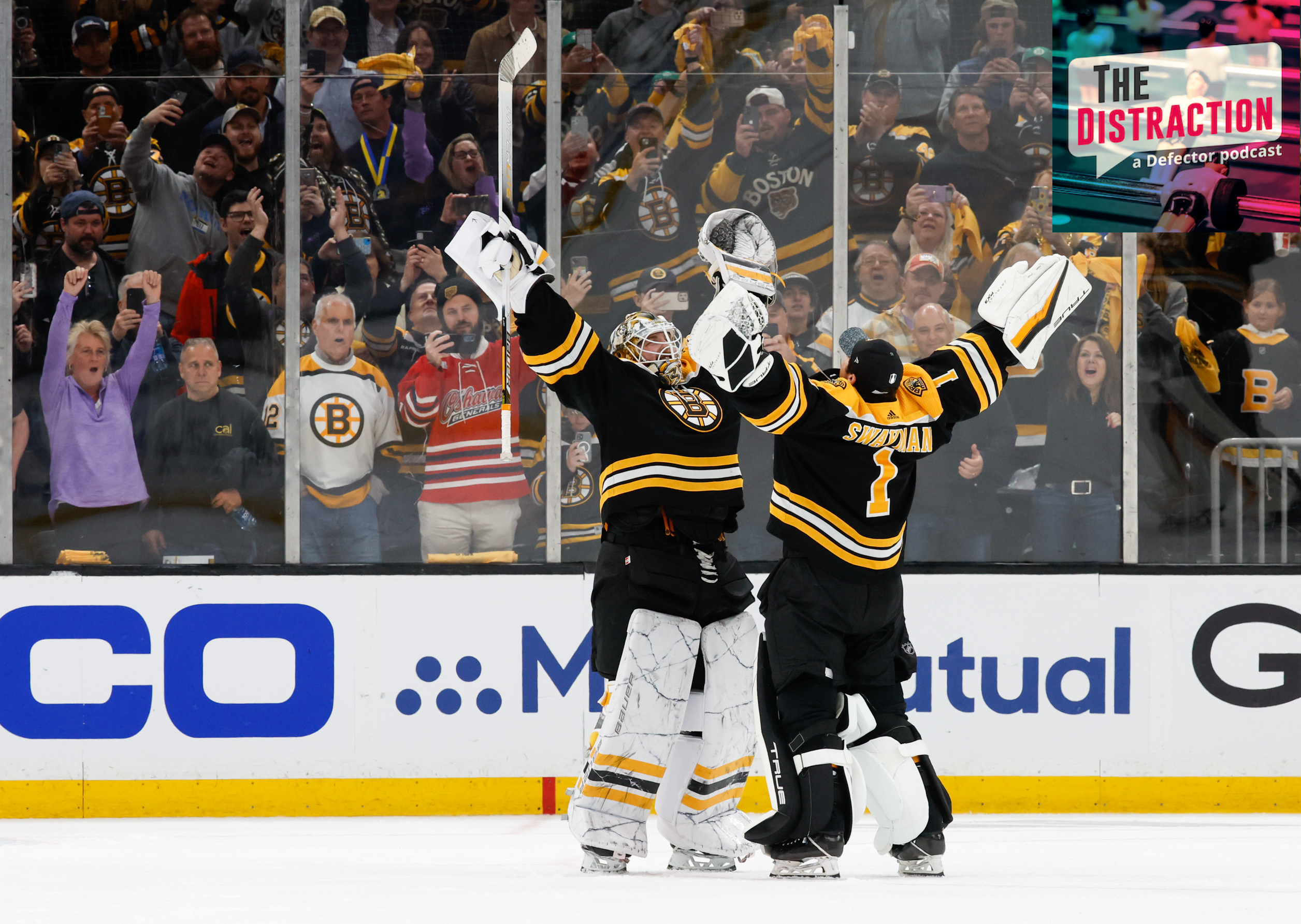 Jeremy Swayman #1 of the Boston Bruins and teammate Linus Ullmark #35 share a hug after Game One of the First Round of the 2023 Stanley Cup Playoffs.