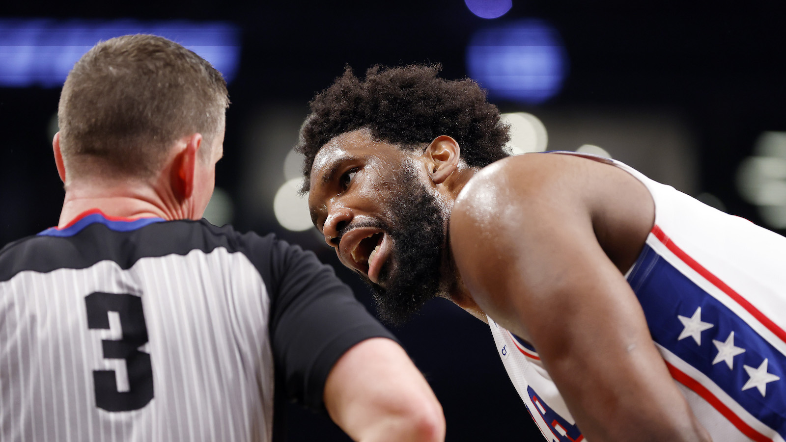NEW YORK, NEW YORK - APRIL 20: Joel Embiid #21 of the Philadelphia 76ers reacts toward referee Nick Buchert #3 against the Brooklyn Nets during the second half of Game Three of the Eastern Conference First Round Playoffs at Barclays Center on April 20, 2023 in the Brooklyn borough of New York City. The 76ers won 102-97. NOTE TO USER: User expressly acknowledges and agrees that, by downloading and or using this photograph, User is consenting to the terms and conditions of the Getty Images License Agreement.