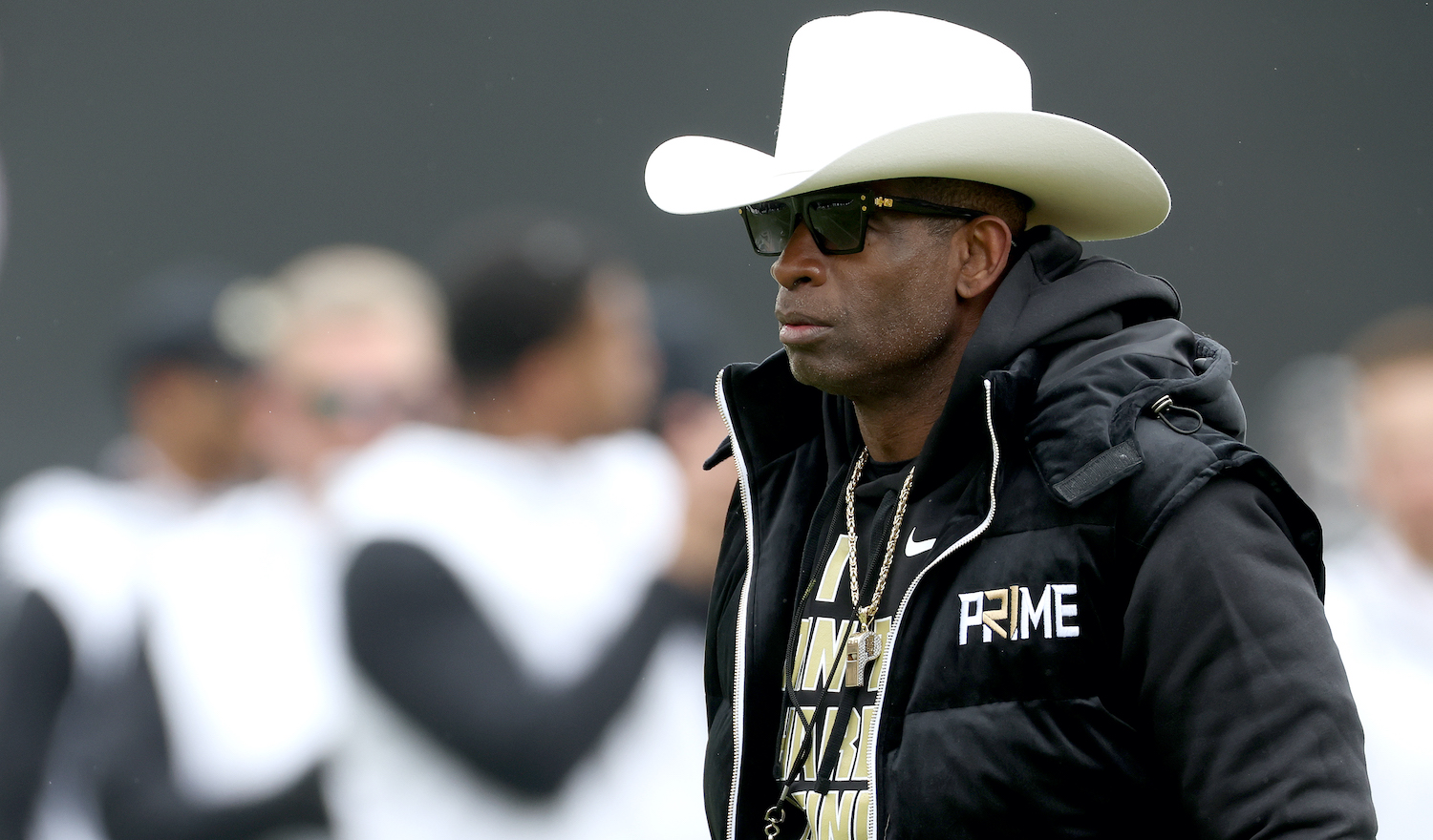 BOULDER, COLORADO - APRIL 22: Head coach Deion Sanders of the Colorado Buffaloes watches as his team warms up prior to their spring game at Folsom Field on April 22, 2023 in Boulder, Colorado. (Photo by Matthew Stockman/Getty Images)