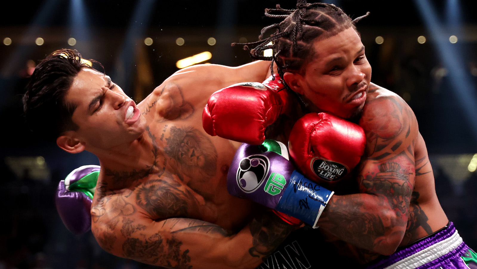 LAS VEGAS, NEVADA - APRIL 22: Ryan Garcia in the black trunks exchanges punches with Gervonta Davis in the green and purple trunks during their catchweight bout at T-Mobile Arena on April 22, 2023 in Las Vegas, Nevada.