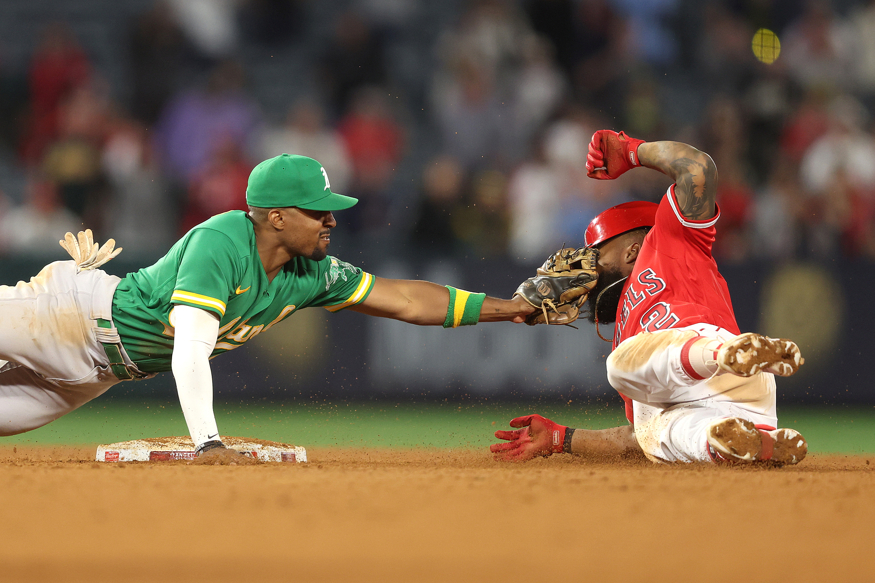 Tony Kemp #5 of the Oakland Athletics tags out Luis Rengifo #2 of the Los Angeles Angels at second base during the tenth inning at Angel Stadium of Anaheim on April 24, 2023 in Anaheim, California