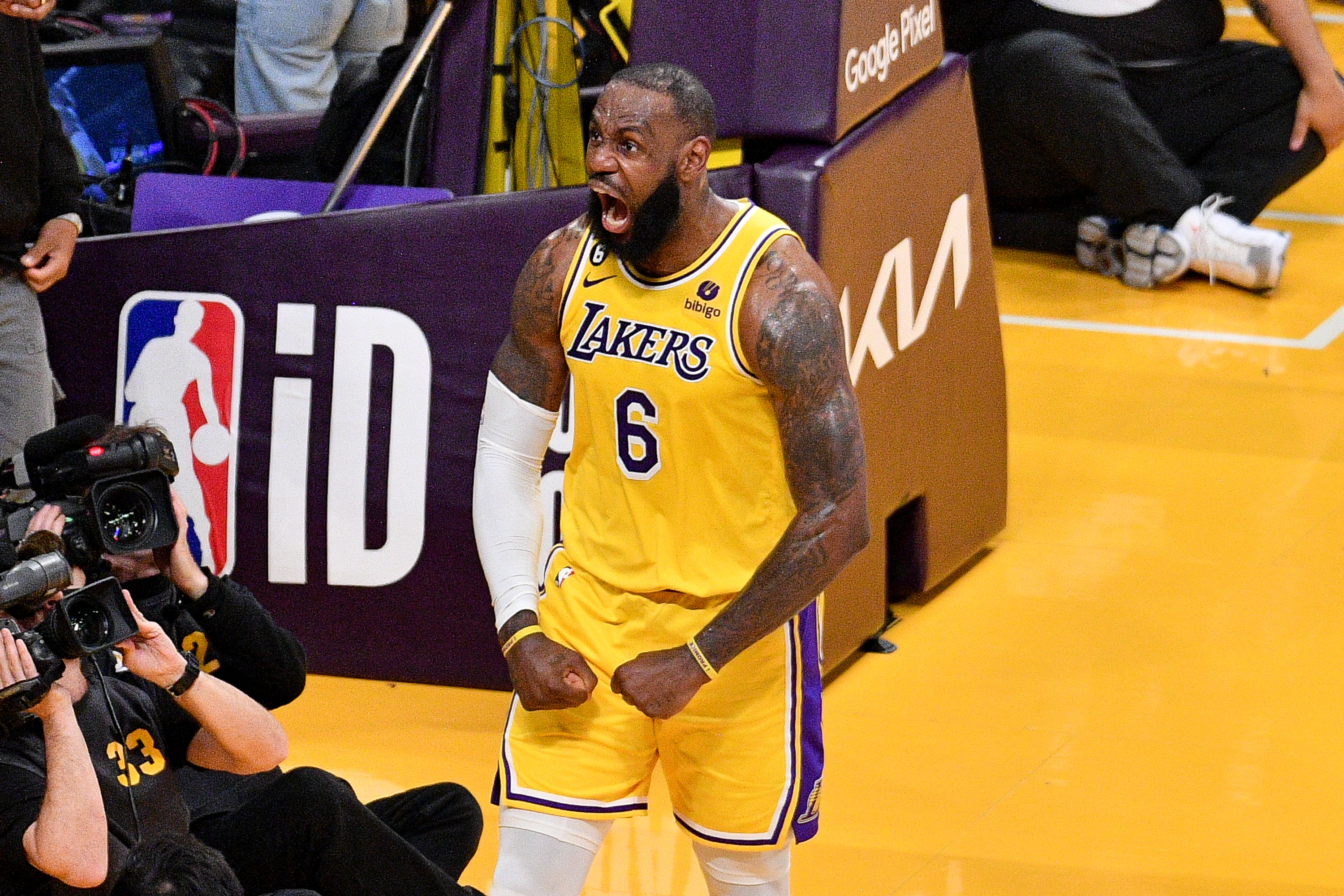 LeBron James celebrates after scoring the decisive overtime basket.