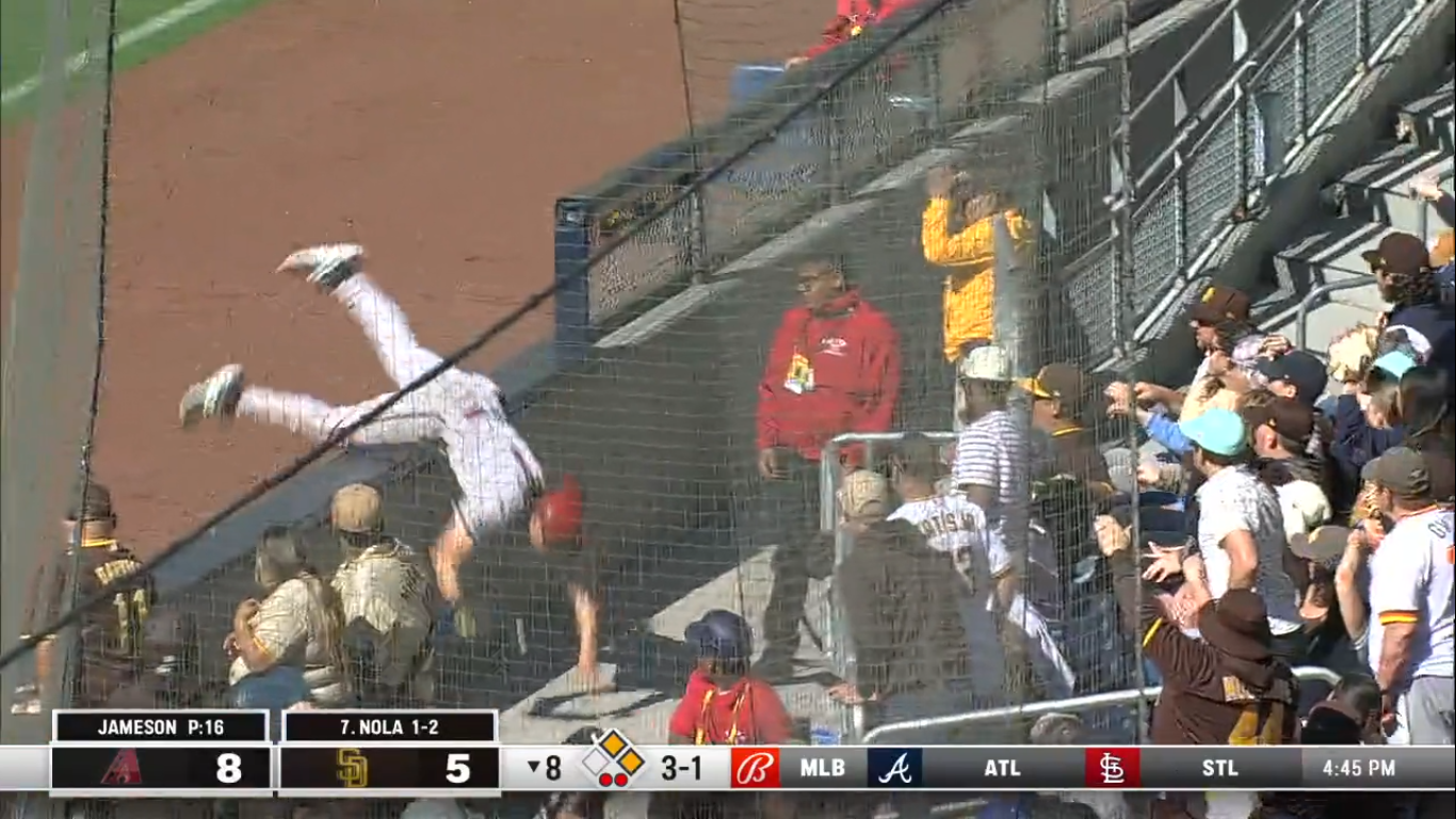 Jake McCarthy goes into the seats for a catch