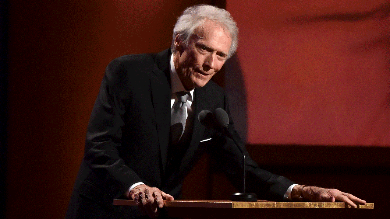 Clint Eastwood at a podium, it's an animated GIF, and different Clint Eastwood fake twitter accounts slowly fill the screen