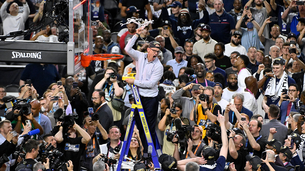 HOUSTON, TEXAS - APRIL 03: Head coach Dan Hurley of the Connecticut Huskies reacts as he cuts down the net after defeating the San Diego State Aztecs 76-59 during the NCAA Men's Basketball Tournament National Championship game at NRG Stadium on April 03, 2023 in Houston, Texas.