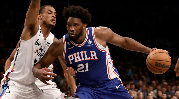 Joel Embiid battles in the post against a member of the Brooklyn Nets