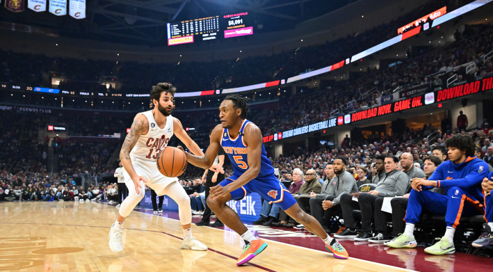 New York's Immanuel Quickley drives toward the basket against Cleveland's Ricky Rubio.