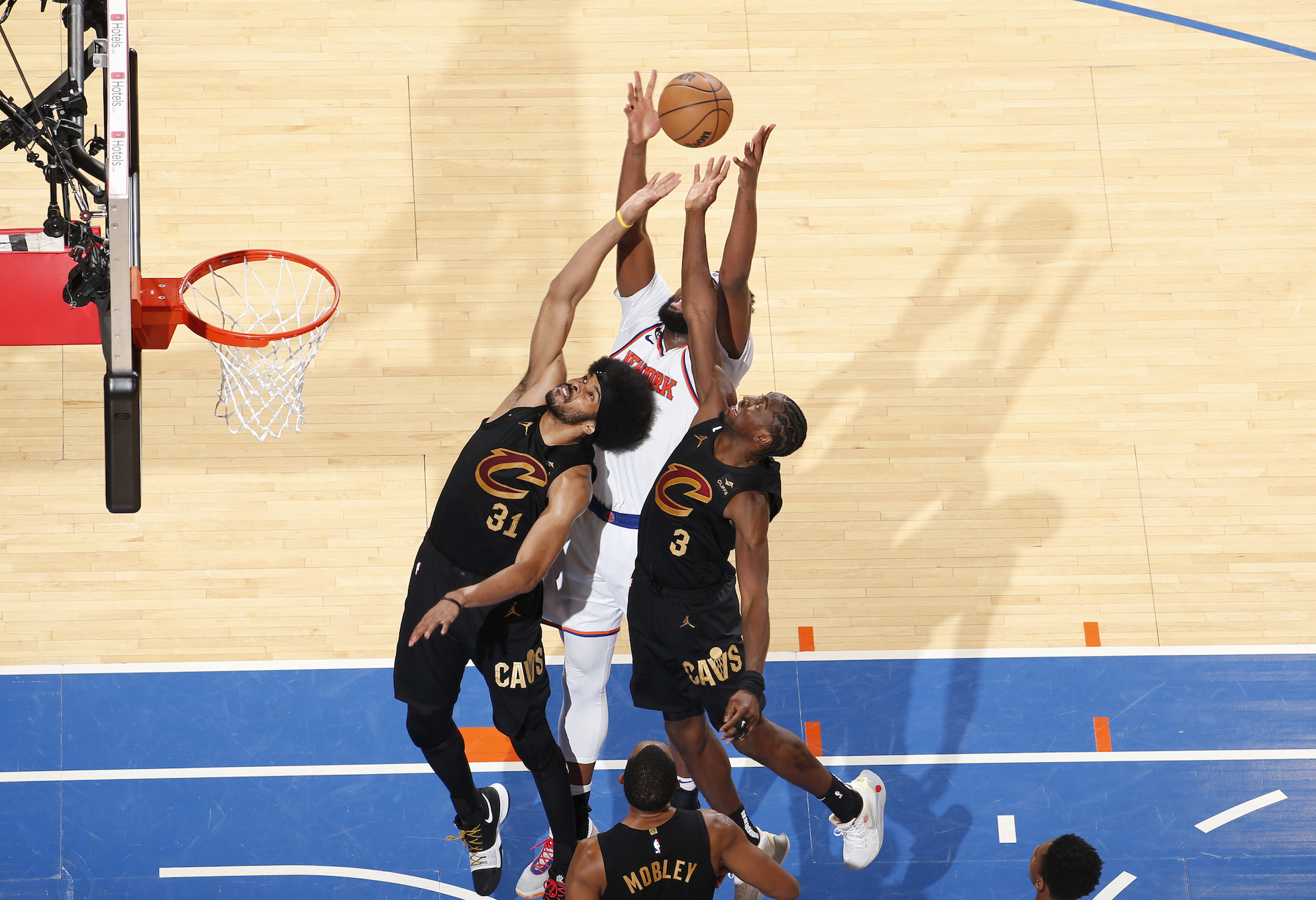 Mitchell Robinson collects a rebound