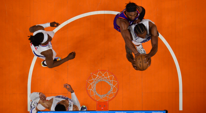 Kawhi Leonard of the Los Angeles Clippers fights for a rebound against the Phoenix Suns, in an overhead photograph