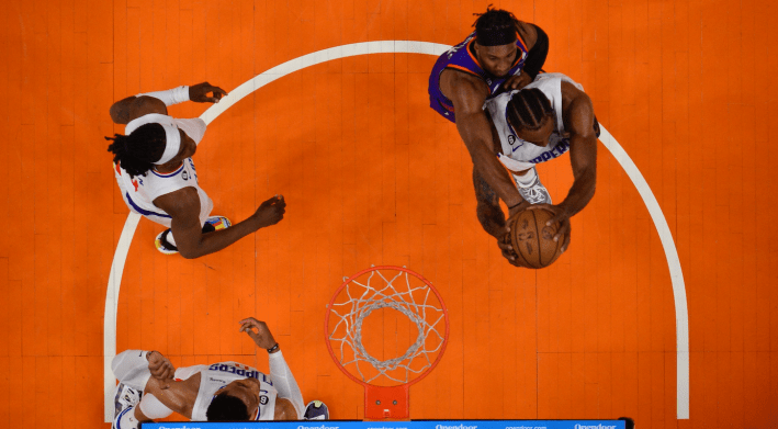 Kawhi Leonard of the Los Angeles Clippers fights for a rebound against the Phoenix Suns, in an overhead photograph