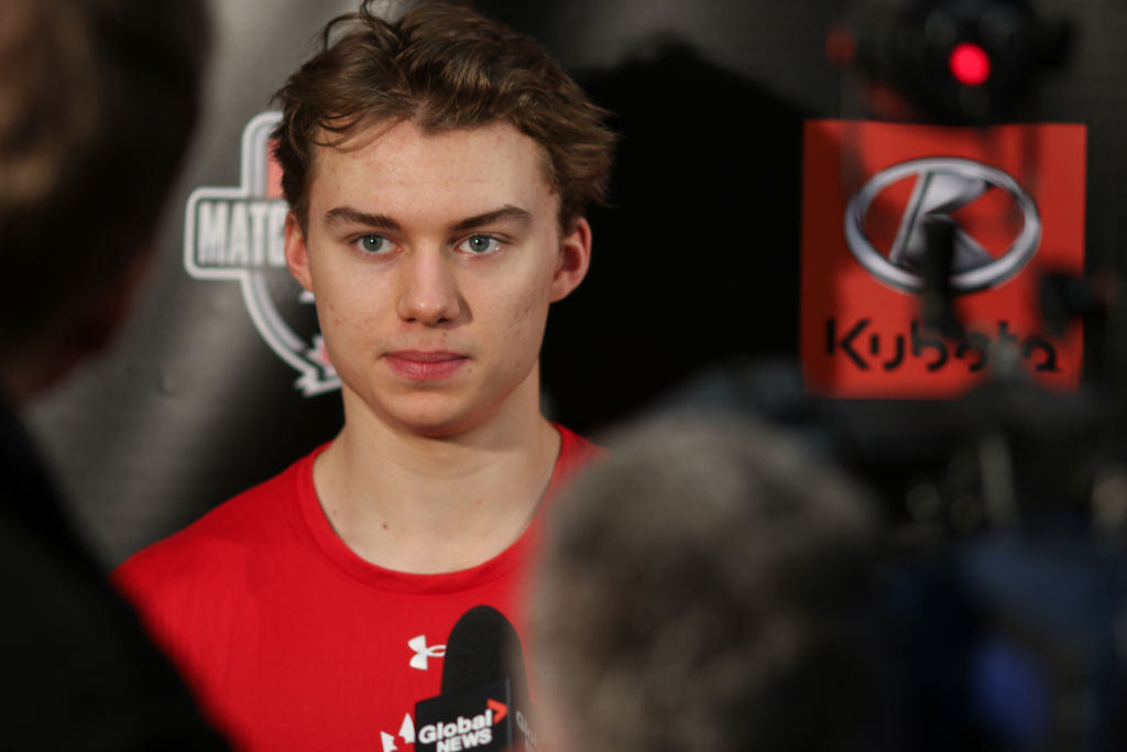 Connor Bedard speaks to the press