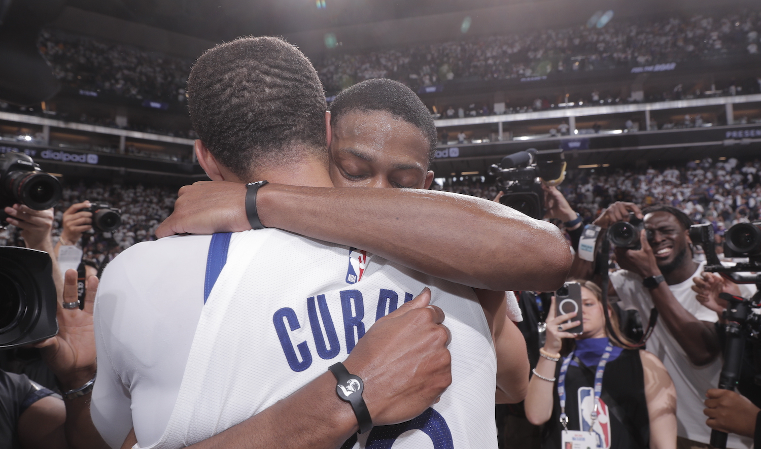 SACRAMENTO, CA - APRIL 30: De'Aaron Fox #5 of the Sacramento Kings embraces Stephen Curry #30 of the Golden State Warriors after Round One Game Seven of the 2023 NBA Playoffs on April 30, 2023 at Golden 1 Center in Sacramento, California. NOTE TO USER: User expressly acknowledges and agrees that, by downloading and or using this Photograph, user is consenting to the terms and conditions of the Getty Images License Agreement. Mandatory Copyright Notice: Copyright 2023 NBAE (Photo by Rocky Widner/NBAE via Getty Images)