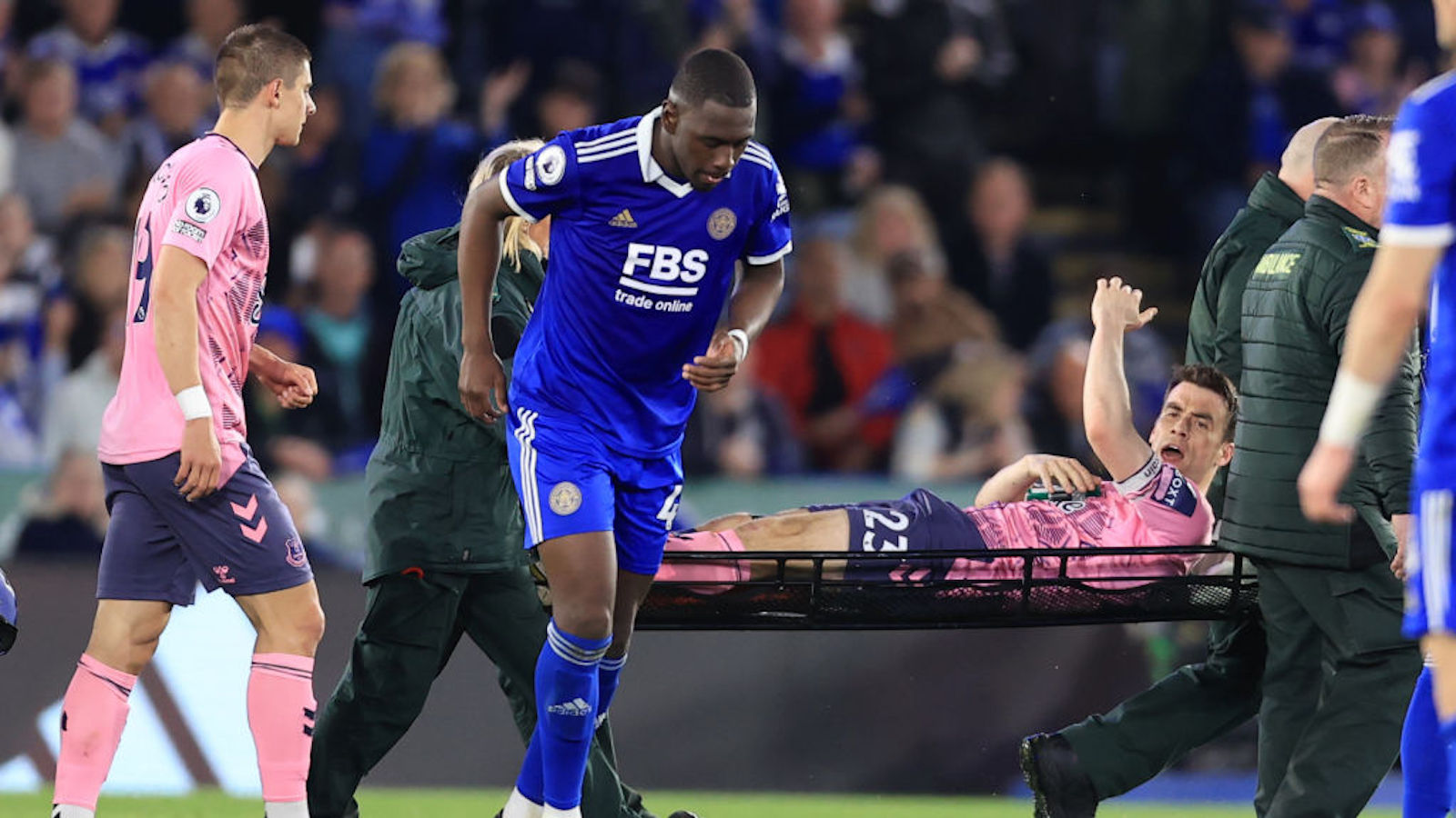 LEICESTER, ENGLAND - MAY 01: Everton captain Seamus Coleman encourages the Everton supporters as he is carried from the field on a stretcher during the Premier League match between Leicester City and Everton FC at The King Power Stadium on May 1, 2023 in Leicester, United Kingdom.