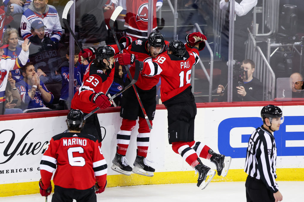 Michael McLeod and the Devils celebrate after a goal