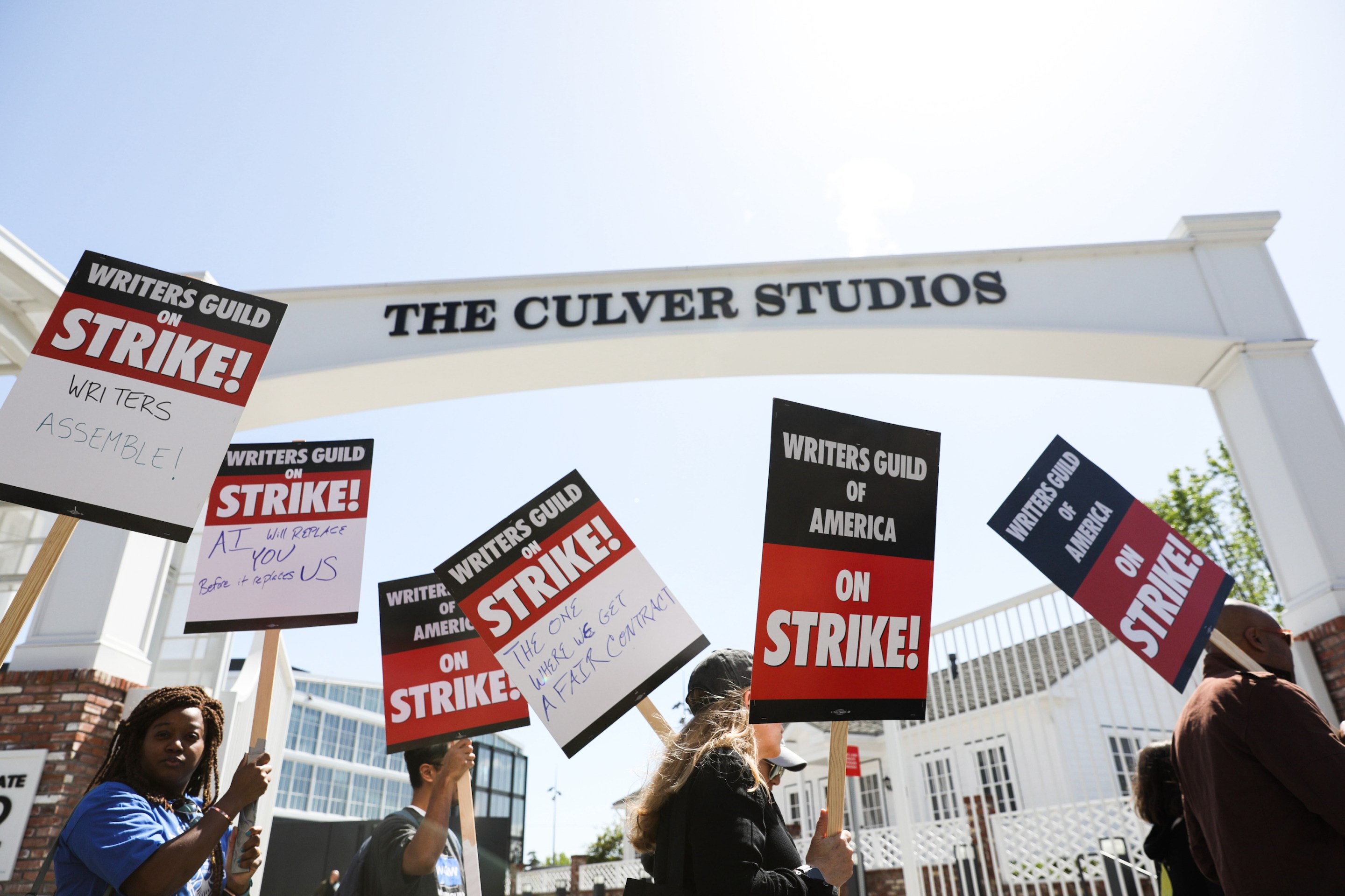 Writers Guild of America members walk the picket line on the first day of their strike in front of Amazon studios on Tuesday, May 2, 2023.