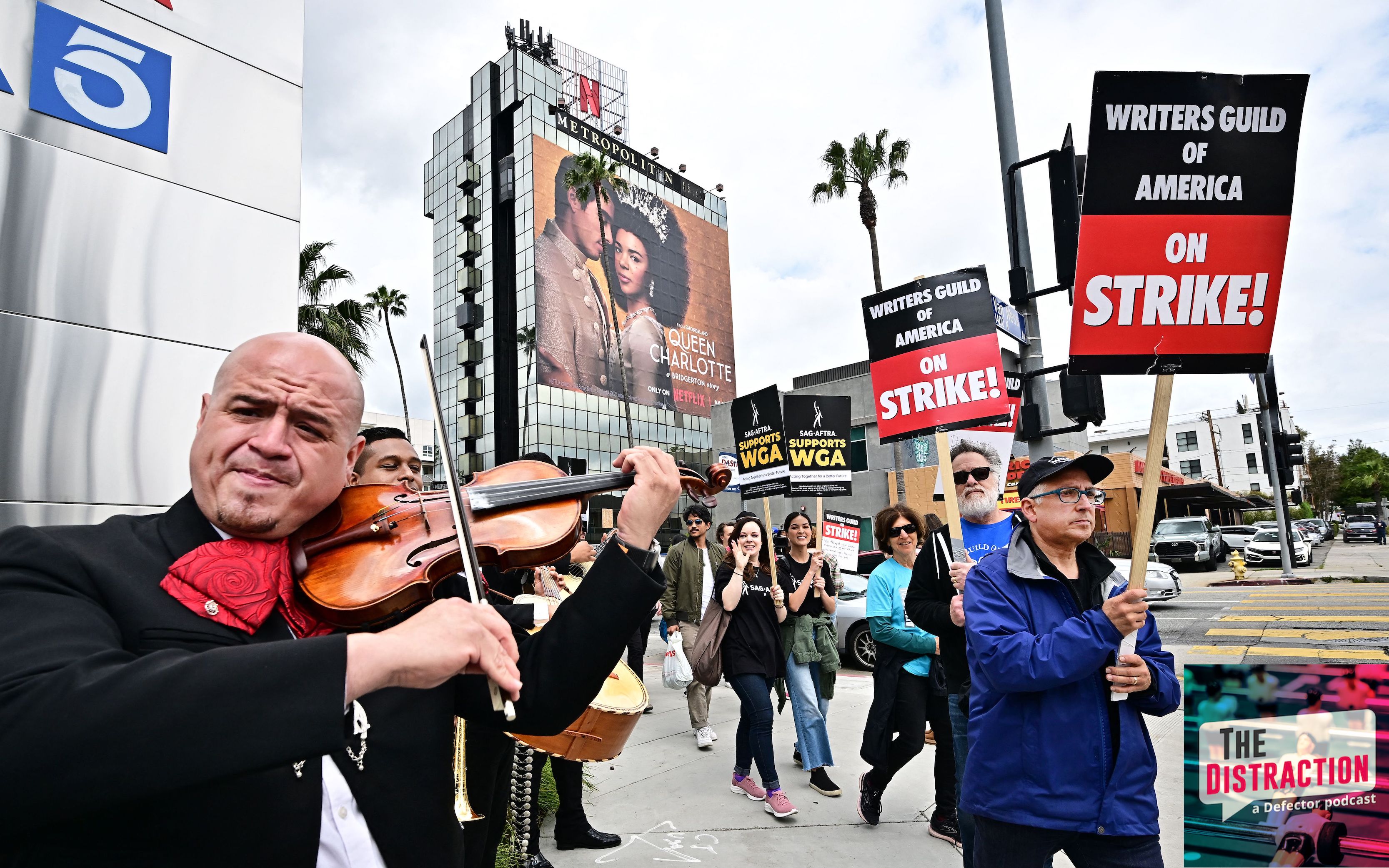 A Mariachi Band performs on Cinco De Mayo as writers on strike march with signs on the picket line on day four of the strike by the Writers Guild of America in front of Netflix in Hollywood, California.