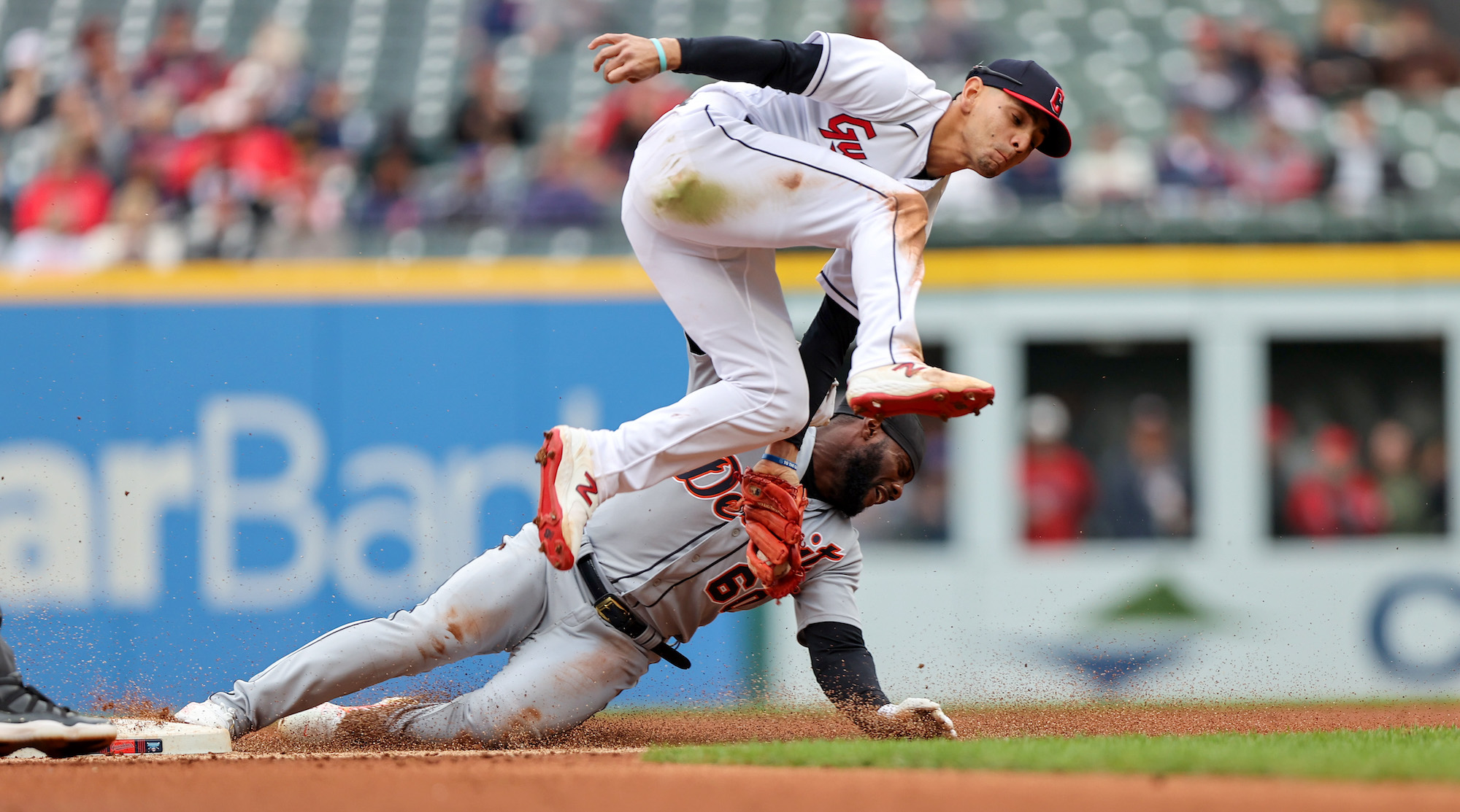 CLEVELAND, OH - MAY 08: Cleveland Guardians second baseman Andres Gimenez (0) tags out Detroit Tigers left fielder Akil Baddoo (60) attempting to steal second base during the second inning of the Major League Baseball game between the Detroit Tigers and Cleveland Guardians on May 8, 2023, at Progressive Field in Cleveland, OH. (Photo by Frank Jansky/Icon Sportswire via Getty Images)