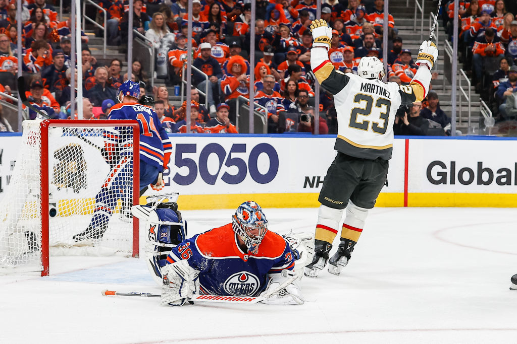 Alec Martinez celebrates a goal on Jack Campbell