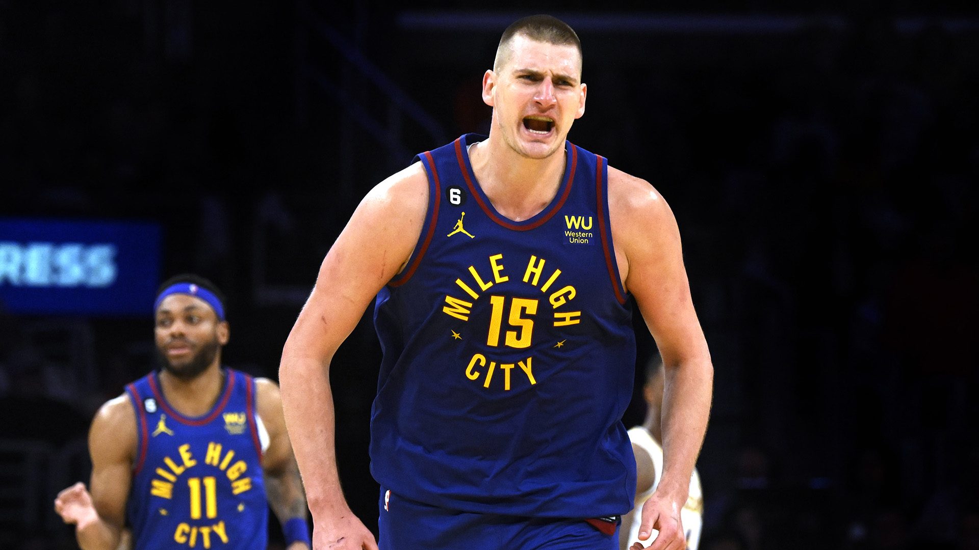Nikola Jokic #15 of the Denver Nuggets react after a three point basket against the Los Angeles Lakers in the second half of game 3 of a Western Conference finals NBA playoff basketball game at Crypto.com Arena in Los Angeles on Saturday, May 20, 2023.
