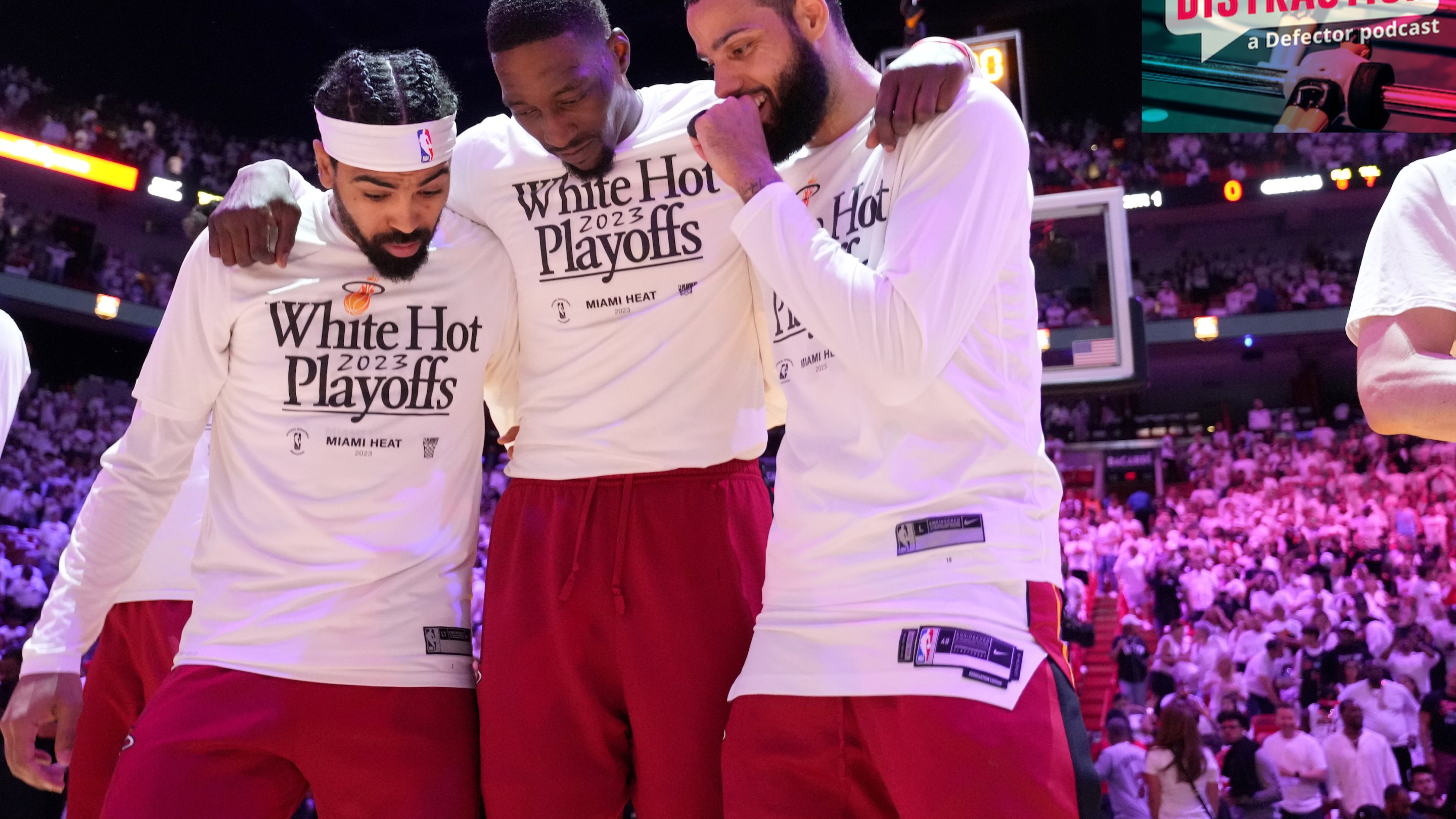 Gabe Vincent, Bam Adebayo, and Caleb Martin stand together as the team is introduced before Game 4 of the Eastern Conference Finals.
