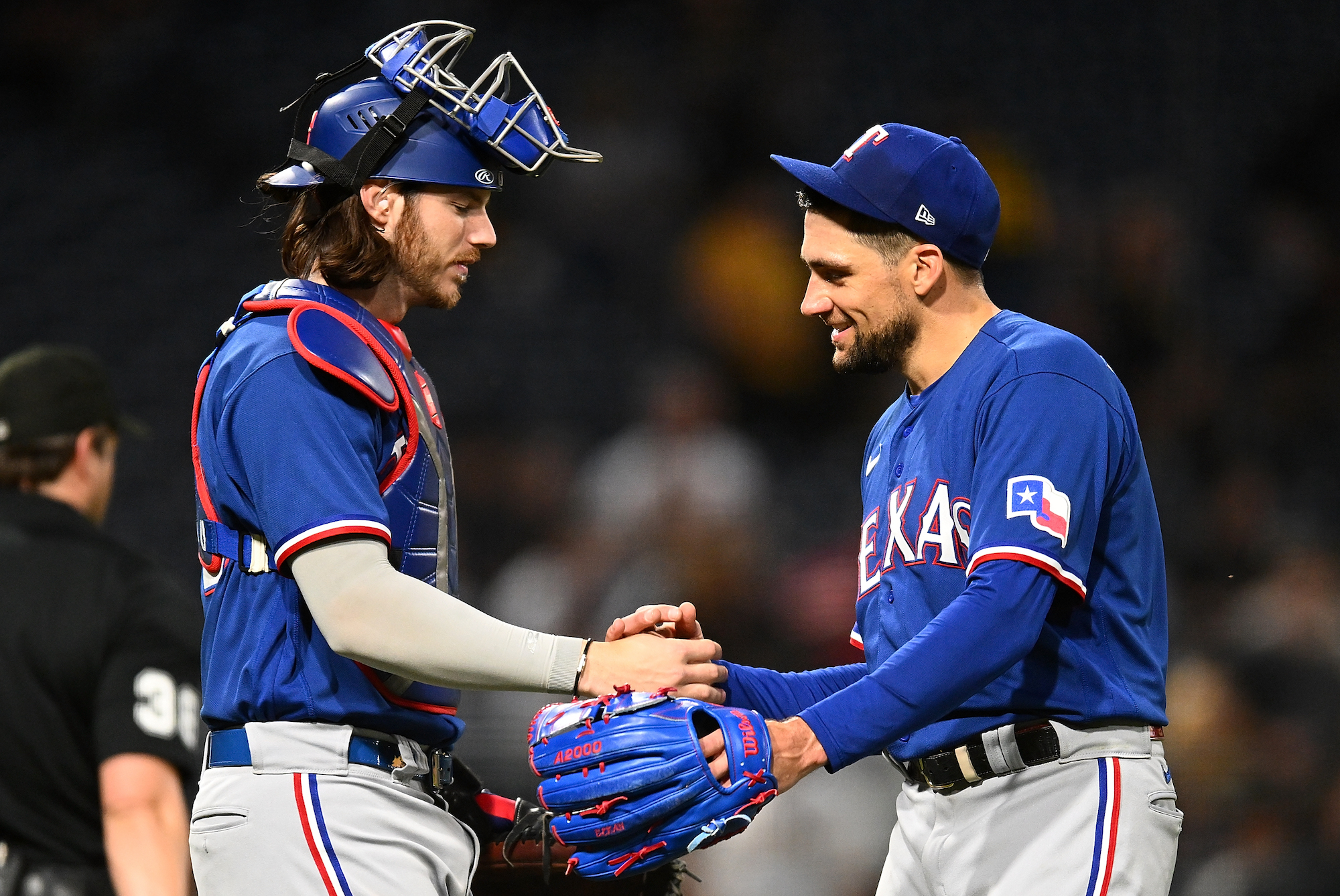 PITTSBURGH, PA - MAY 23: Pitcher Nathan Eovaldi #17 of the Texas Rangers celebrates with Jonah Heim #28 after throwing a 6-1 complete game against the Pittsburgh Pirates at PNC Park on May 23, 2023 in Pittsburgh, Pennsylvania. (Photo by Joe Sargent/Getty Images)