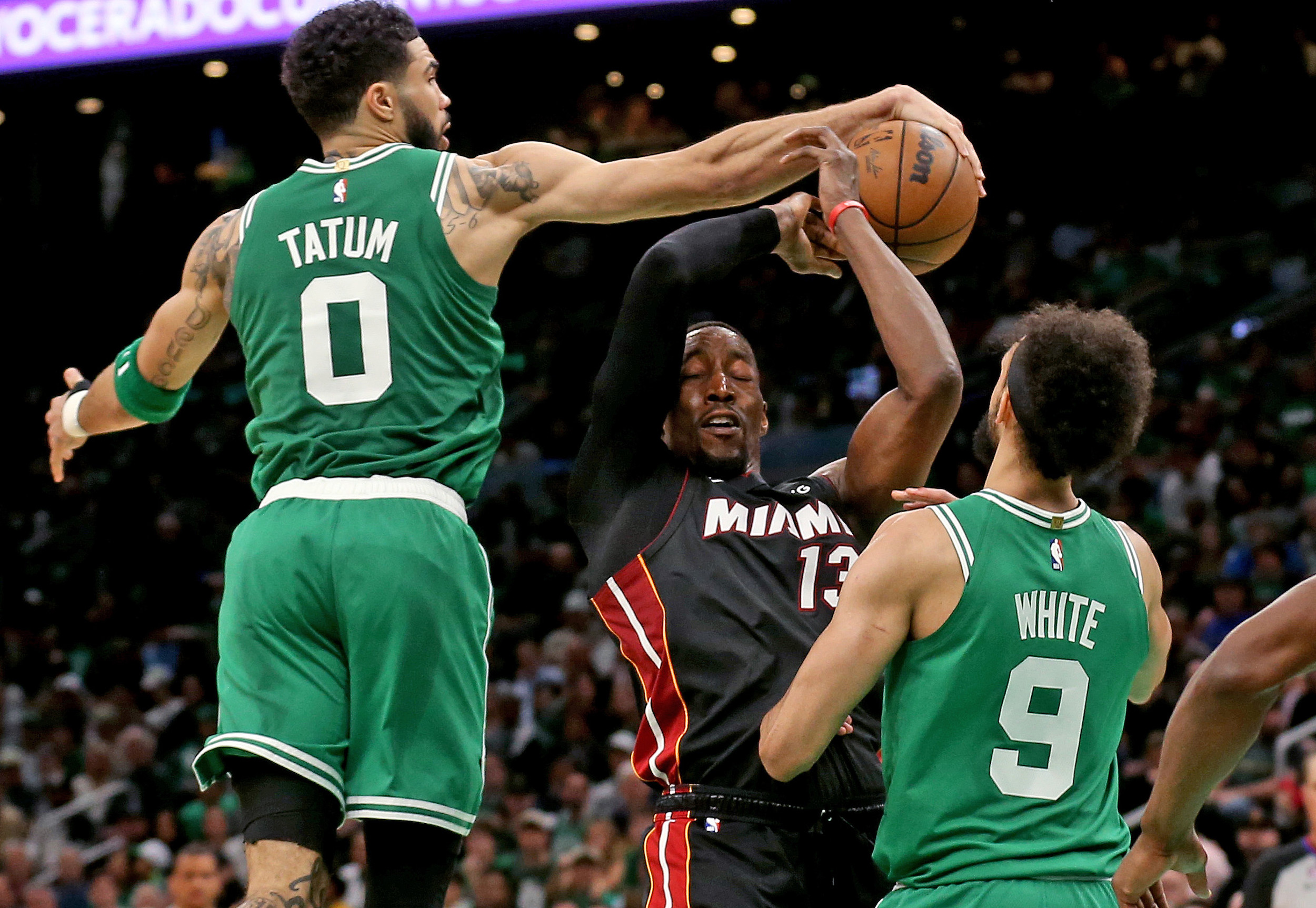 Jayson Tatum blocks the shot of Bam Adebayo.